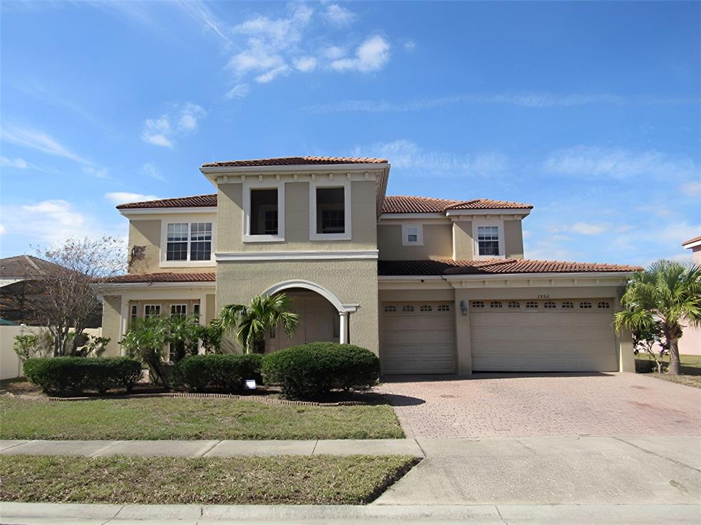 2802 Quiet Water Trail Kissimmee, FL 34744 - Photo 1 of 1 a front view of a house with a yard