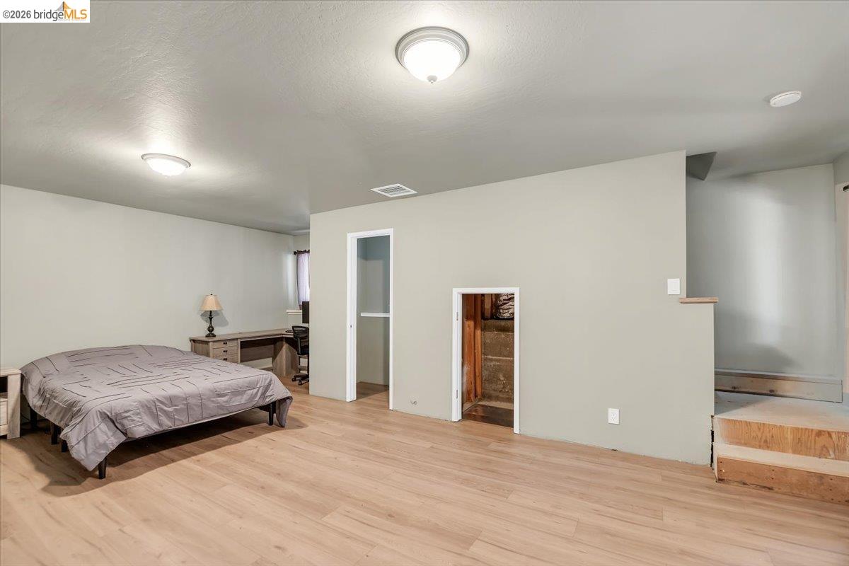 8733 Fraguero Road Sonora, CA 95370 - Photo 54 of 73 Expansive interior space featuring wood-finish flooring, neutral wall tones, and recessed ceiling lighting
