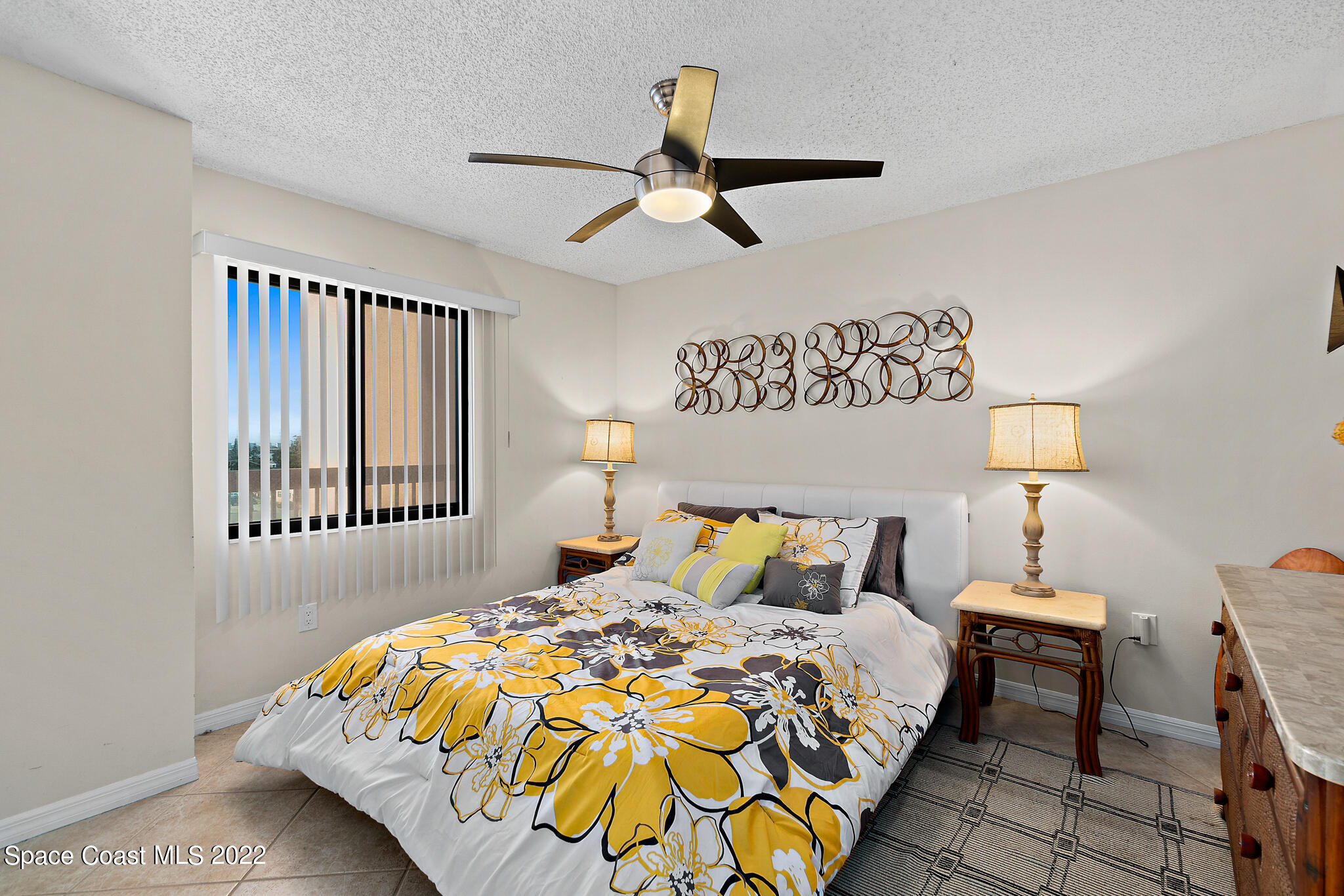 6770 Ridgewood Avenue, Unit 502 Cocoa Beach, FL 32931 - Photo 14 of 25 a bedroom with a bed and a window