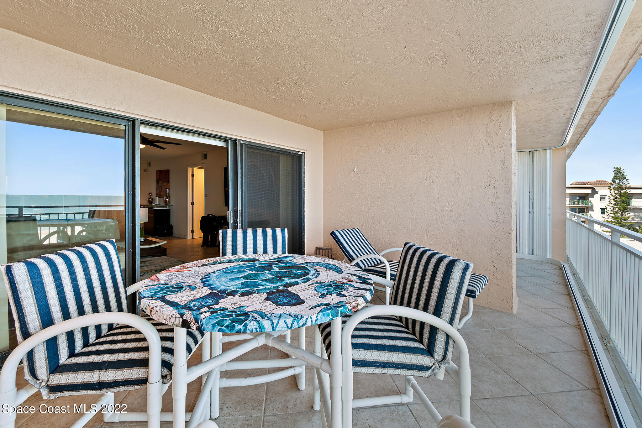 6770 Ridgewood Avenue, Unit 502 Cocoa Beach, FL 32931 - Photo 17 of 25 a view of a dining room with furniture and window
