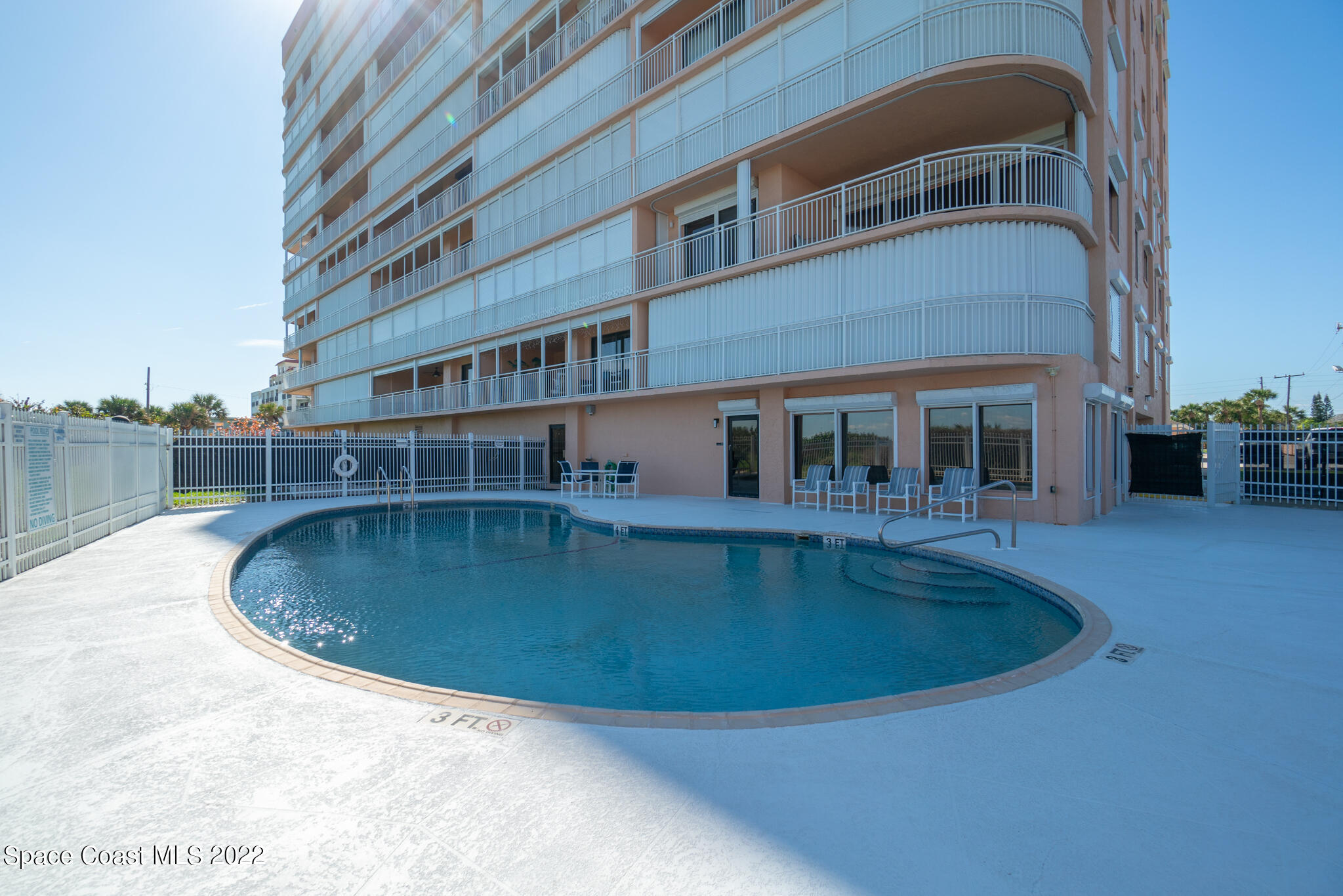 6770 Ridgewood Avenue, Unit 502 Cocoa Beach, FL 32931 - Photo 21 of 25 a view of a house with swimming pool