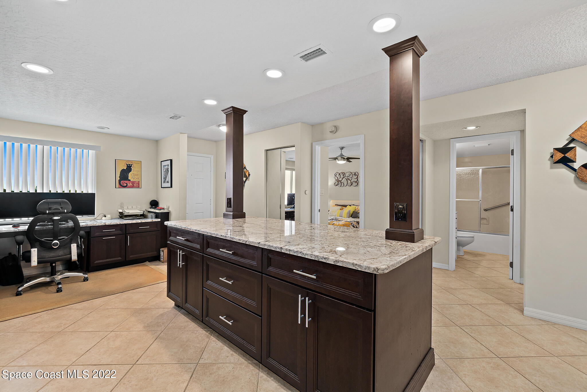 6770 Ridgewood Avenue, Unit 502 Cocoa Beach, FL 32931 - Photo 6 of 25 a kitchen with a refrigerator and a sink