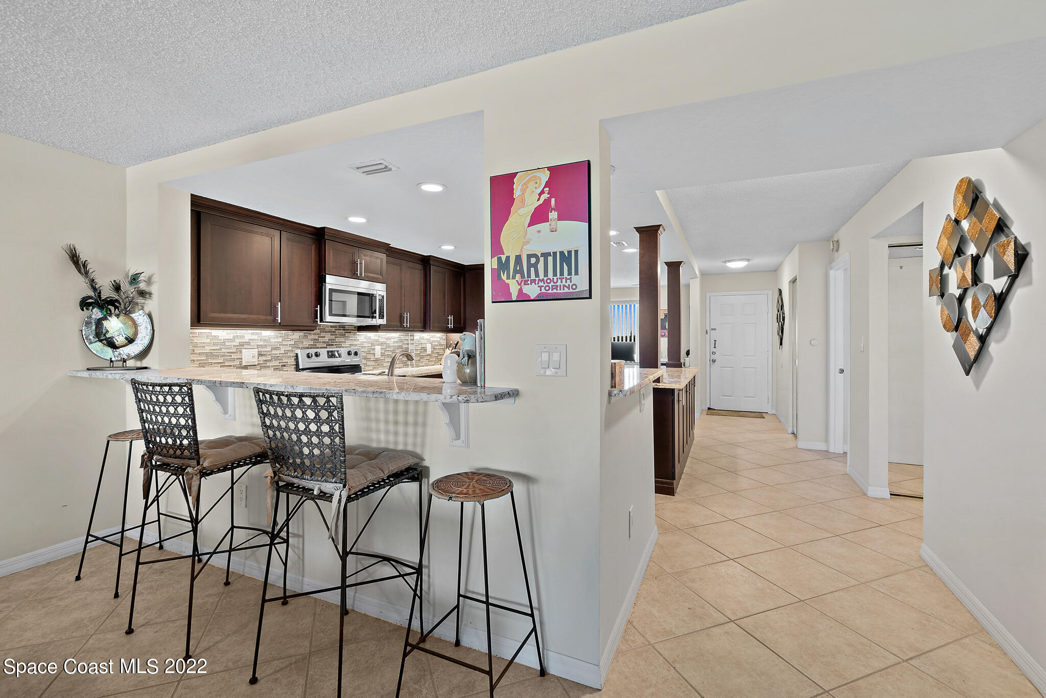 6770 Ridgewood Avenue, Unit 502 Cocoa Beach, FL 32931 - Photo 7 of 25 a view of a dining room with furniture