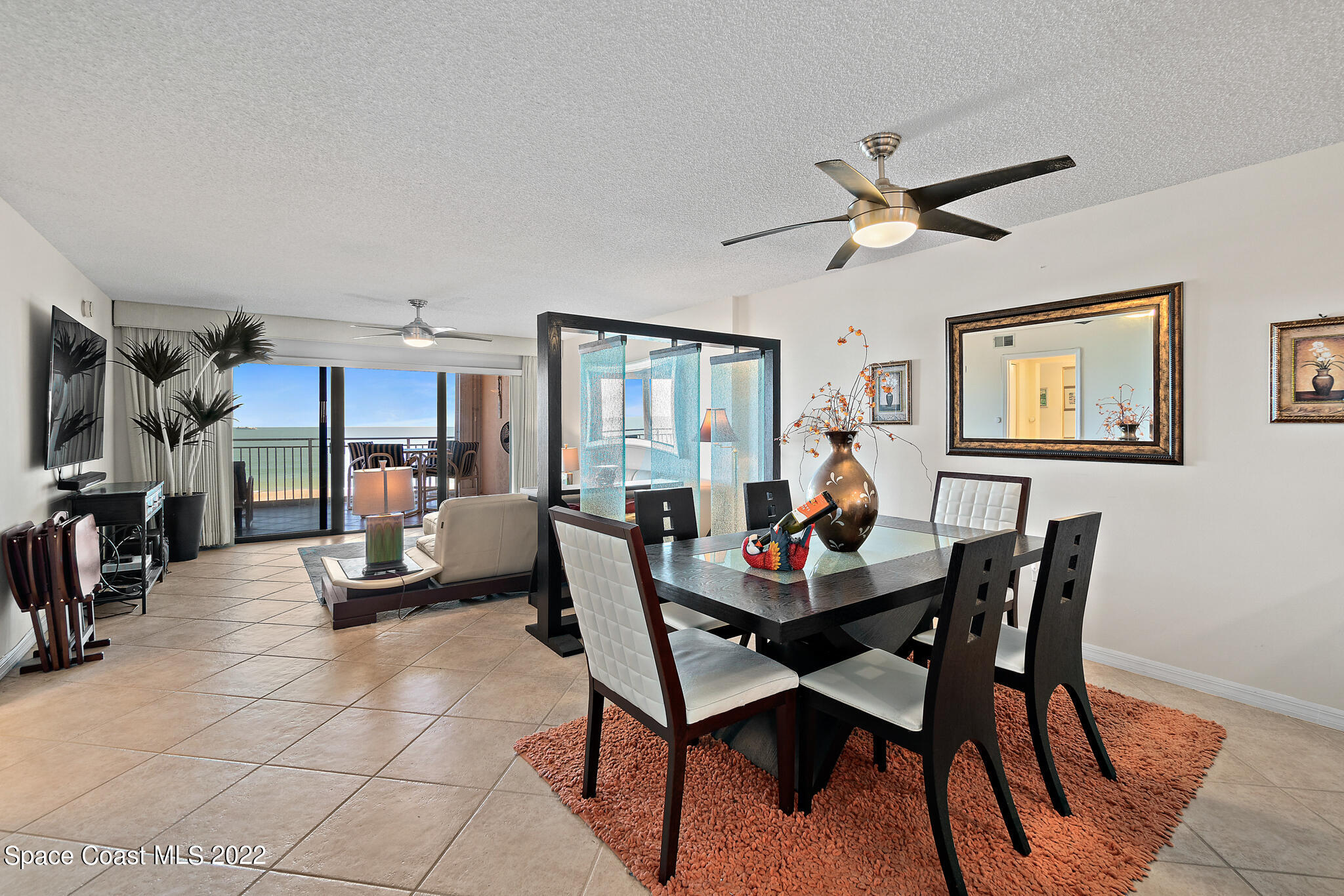 6770 Ridgewood Avenue, Unit 502 Cocoa Beach, FL 32931 - Photo 8 of 25 a dining room with furniture and window