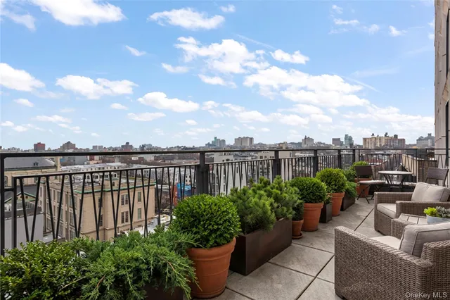a view of a balcony with furniture