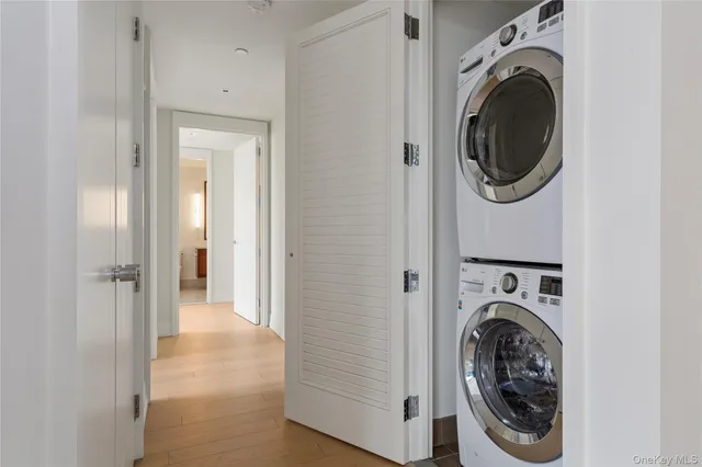 a view of a hallway with washer and dryer