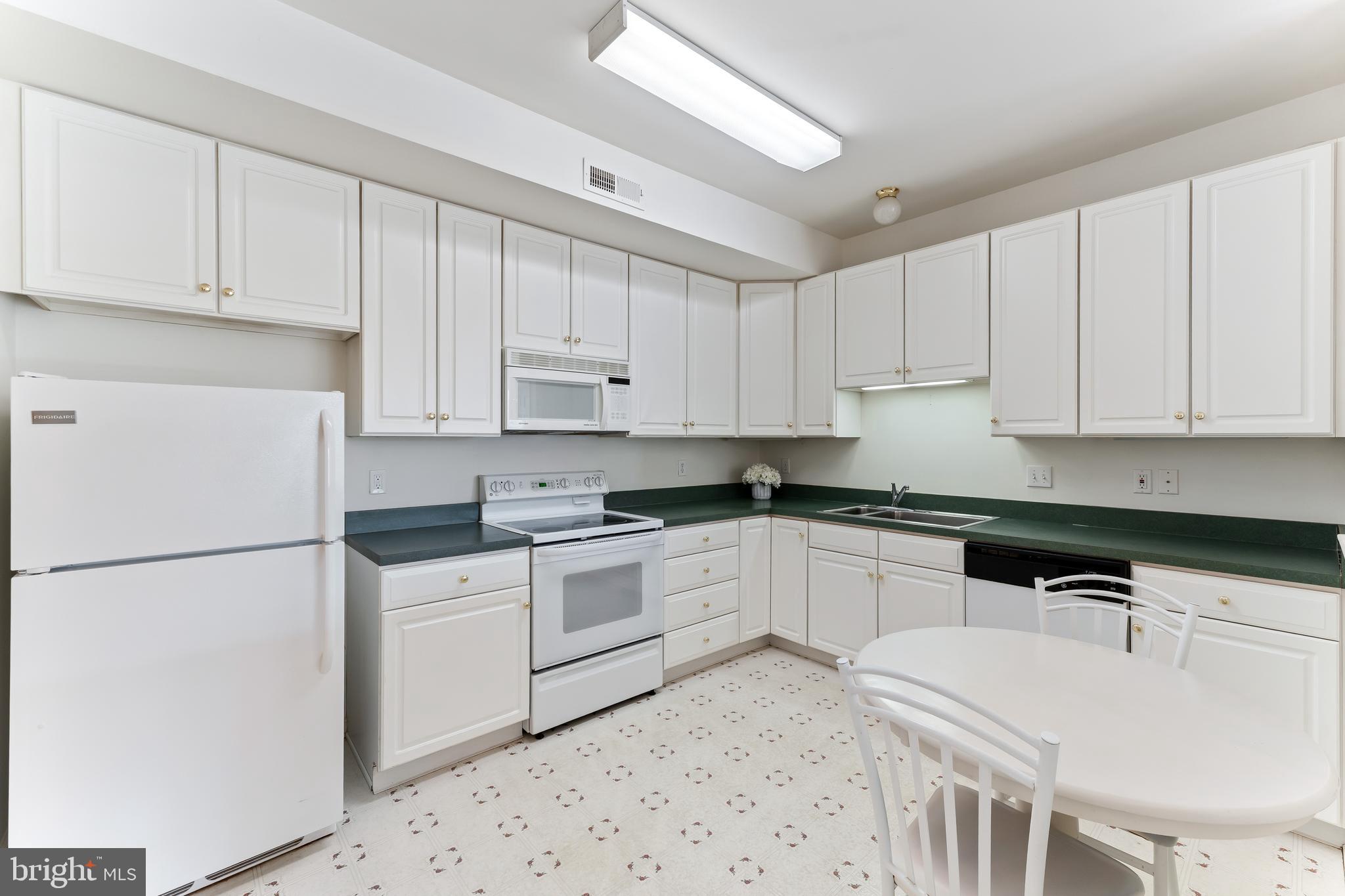 1552 Palmer Drive Springfield, PA 19064 - Photo 11 of 23 a kitchen with cabinets appliances a sink and a counter space