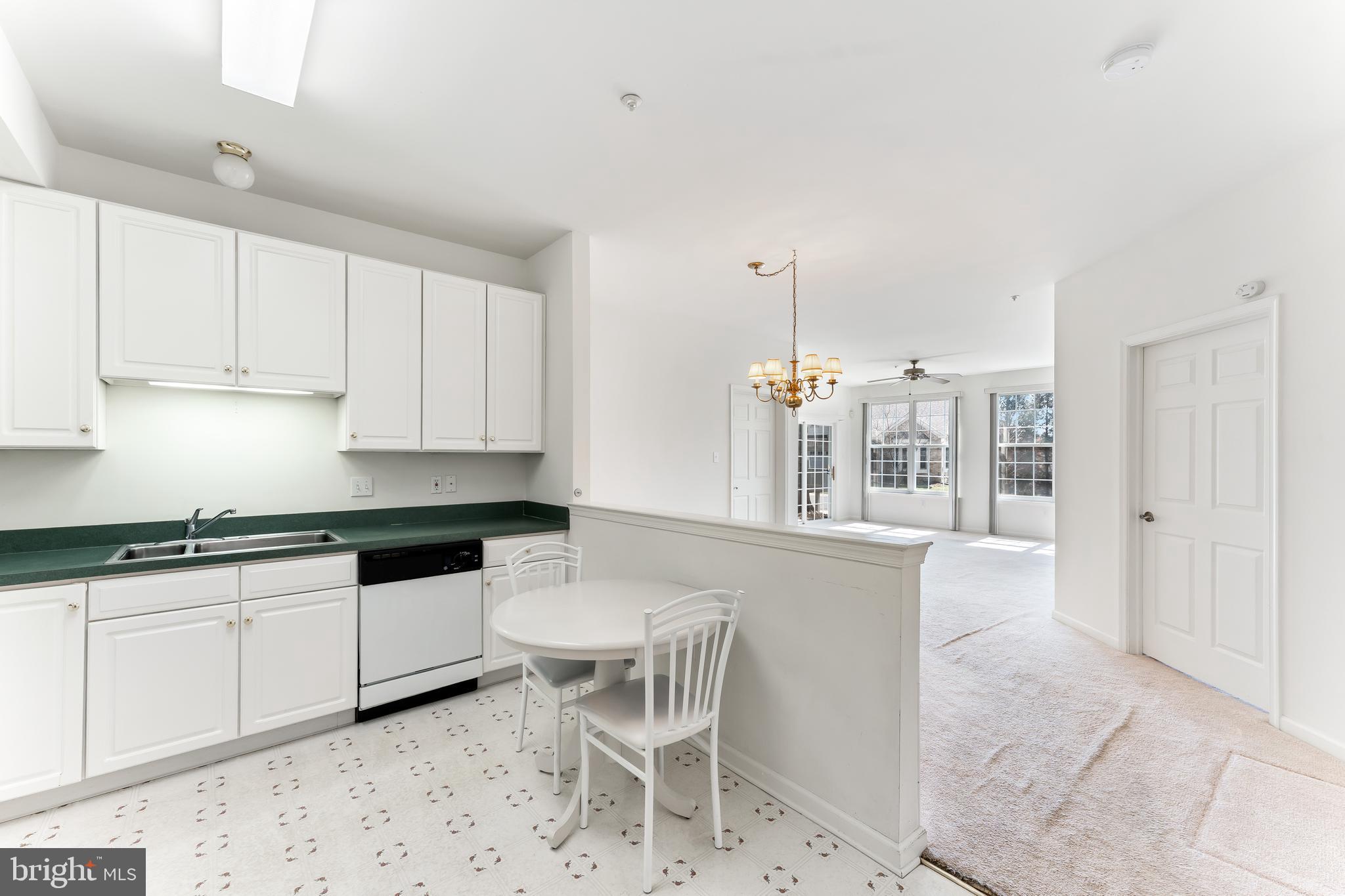 1552 Palmer Drive Springfield, PA 19064 - Photo 23 of 23 a kitchen with granite countertop white cabinets and white appliances