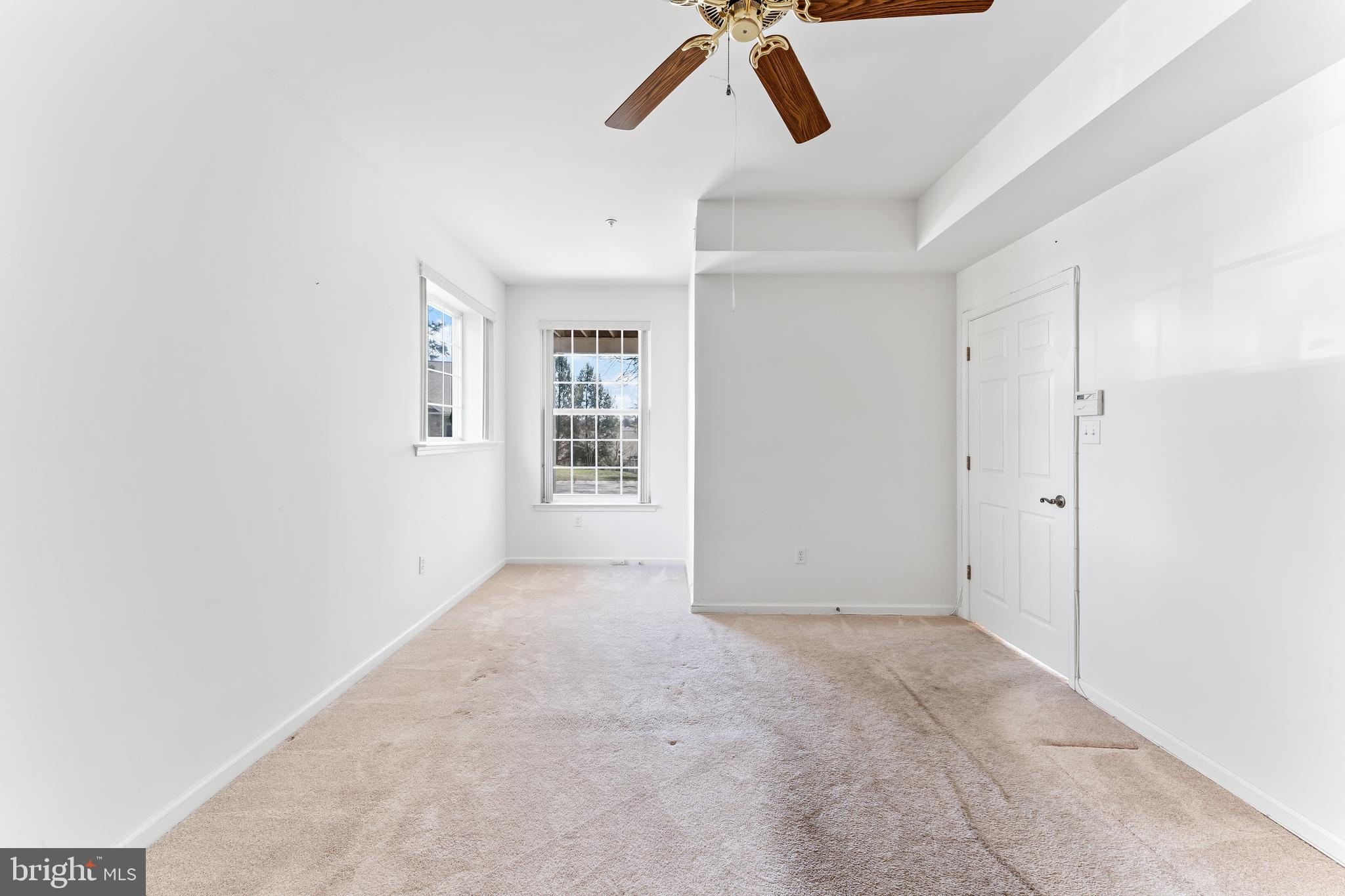 1552 Palmer Drive Springfield, PA 19064 - Photo 15 of 23 an empty room with windows and ceiling fan