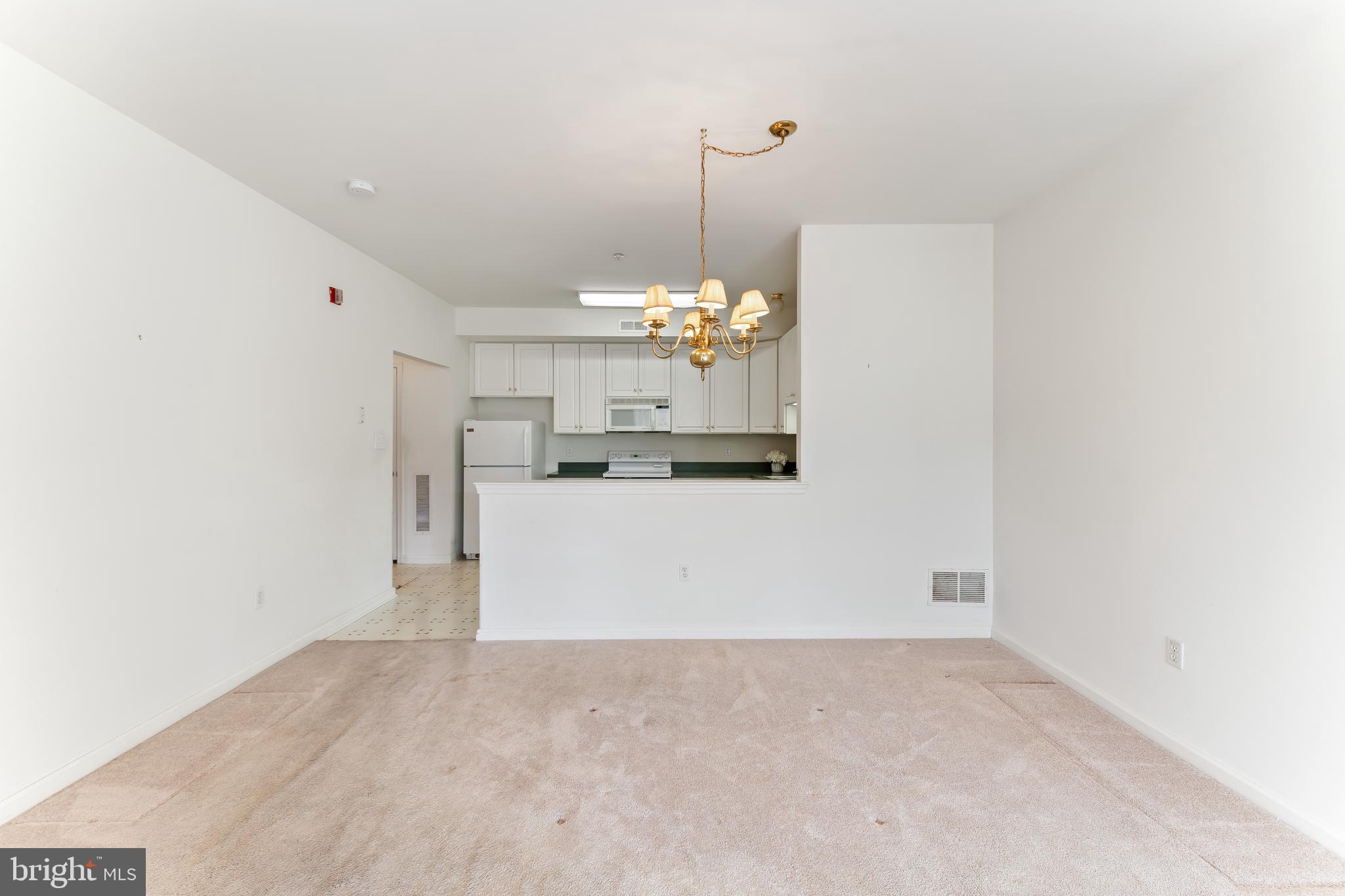 1552 Palmer Drive Springfield, PA 19064 - Photo 9 of 23 a view of a kitchen with a sink and chandelier