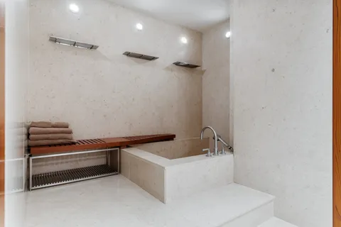 a bathroom with a sink and a large mirror