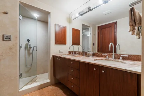 a bathroom with a sink toilet and mirror