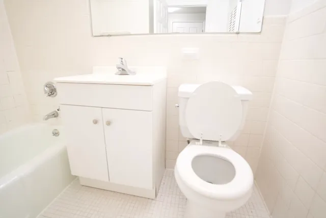 a bathroom with a toilet and a sink