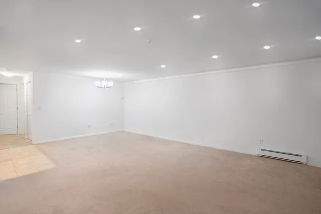 an empty room with a empty space and window