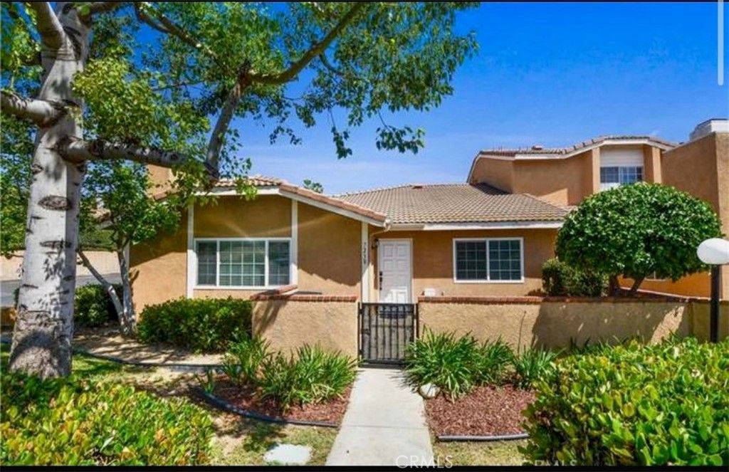 7238 Hermosa Avenue Rancho Cucamonga, CA 91701 - Photo 1 of 23 front view of a house with a yard