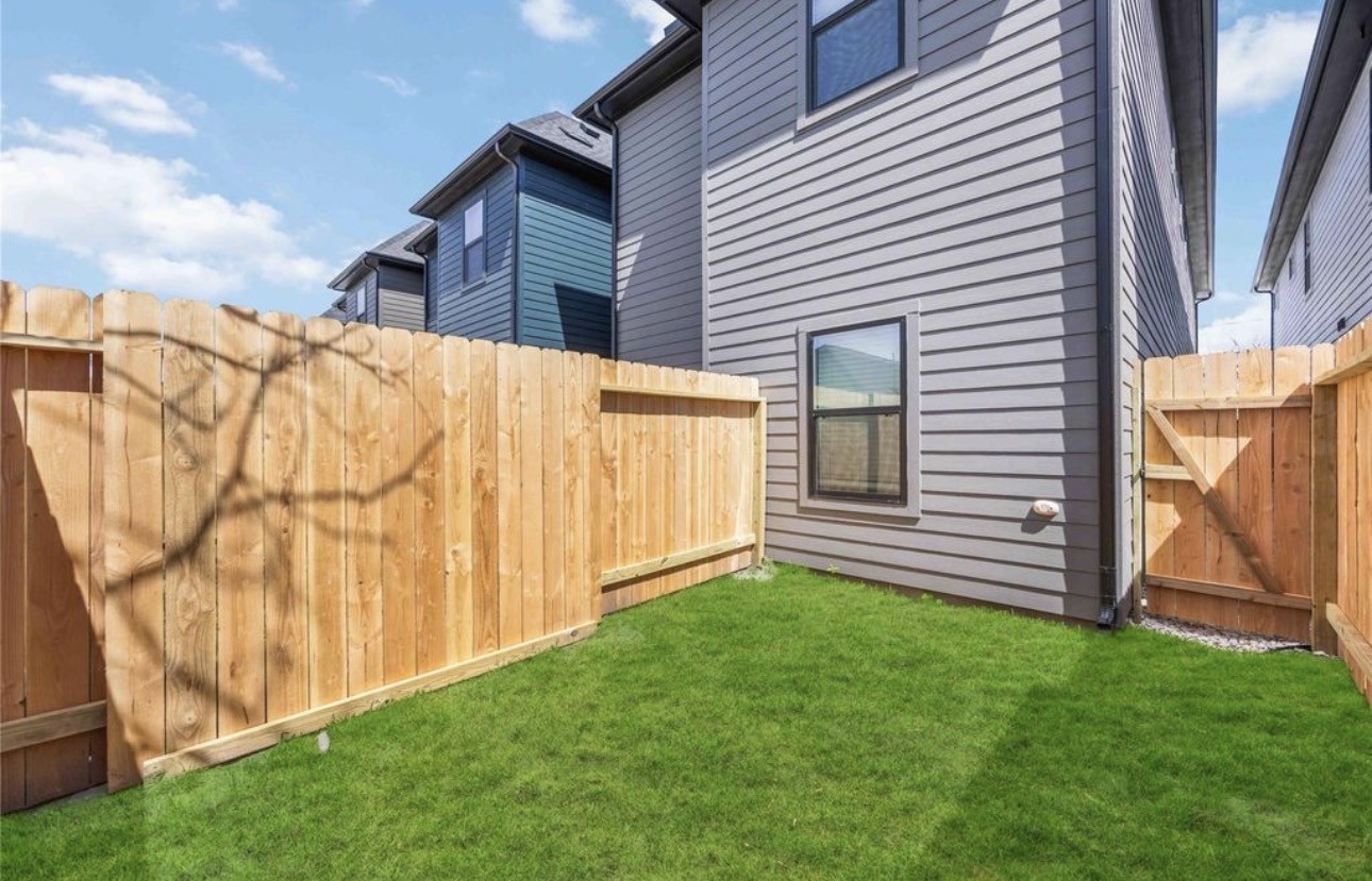 8011 Cora Street, Unit A Houston, TX 77088 - Photo 14 of 14 a backyard of a house with lots of green space
