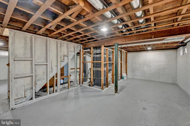 a view of an empty room with wooden walls