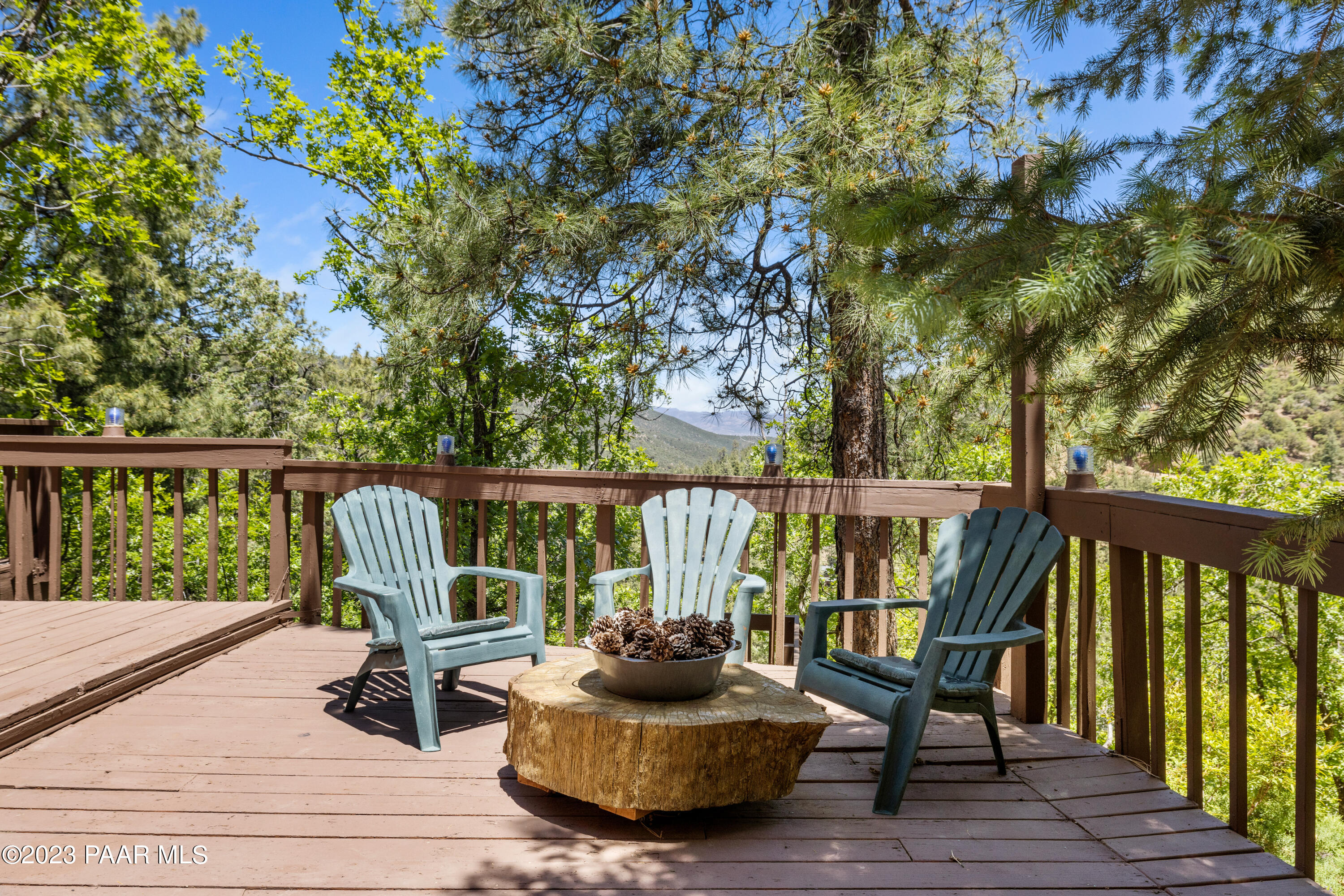 8434 Mountain View Road Mayer, AZ 86333 - Photo 9 of 33 a view of a deck with chairs and wooden fence