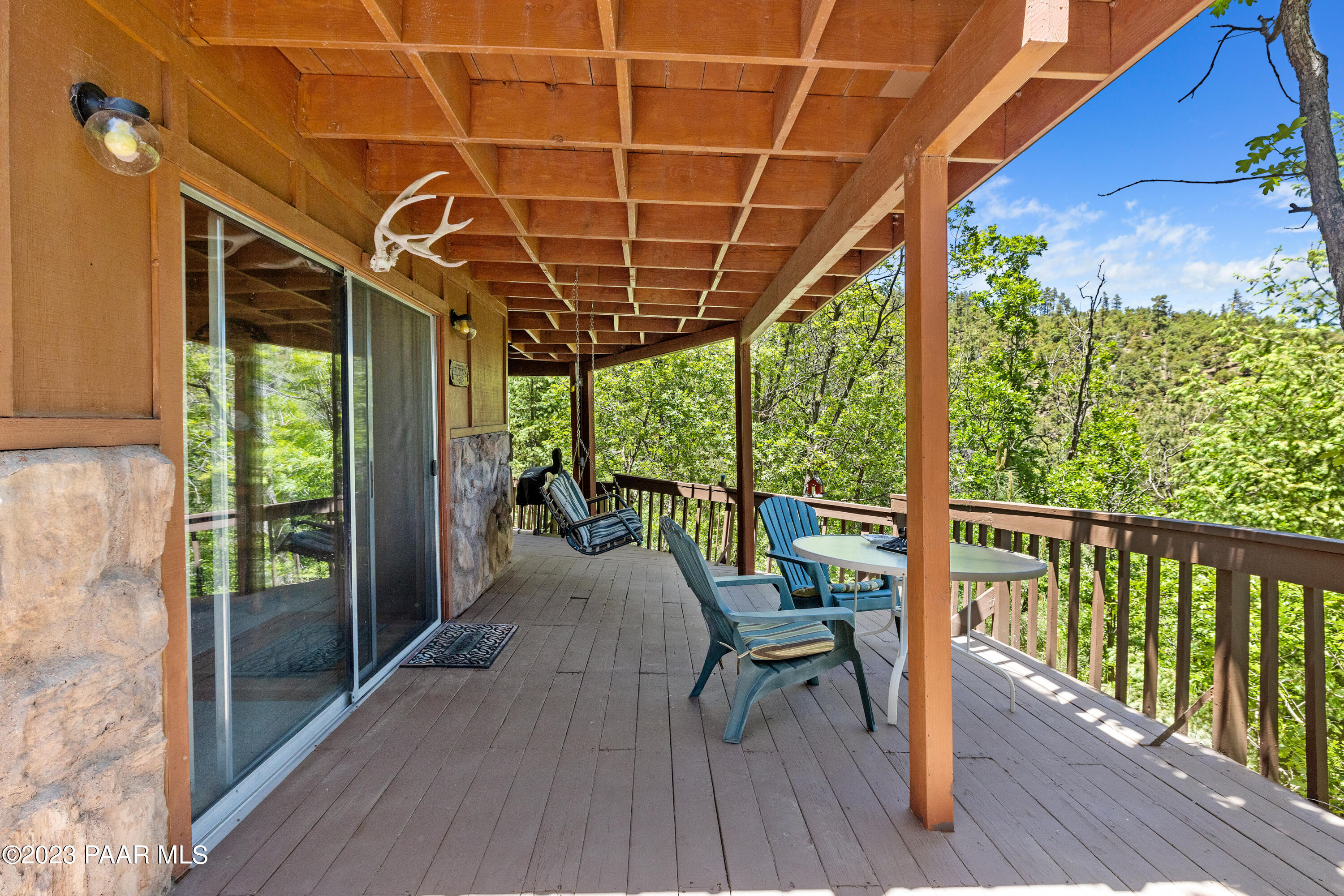 8434 Mountain View Road Mayer, AZ 86333 - Photo 10 of 33 a view of a chairs and table in patio with a small yard
