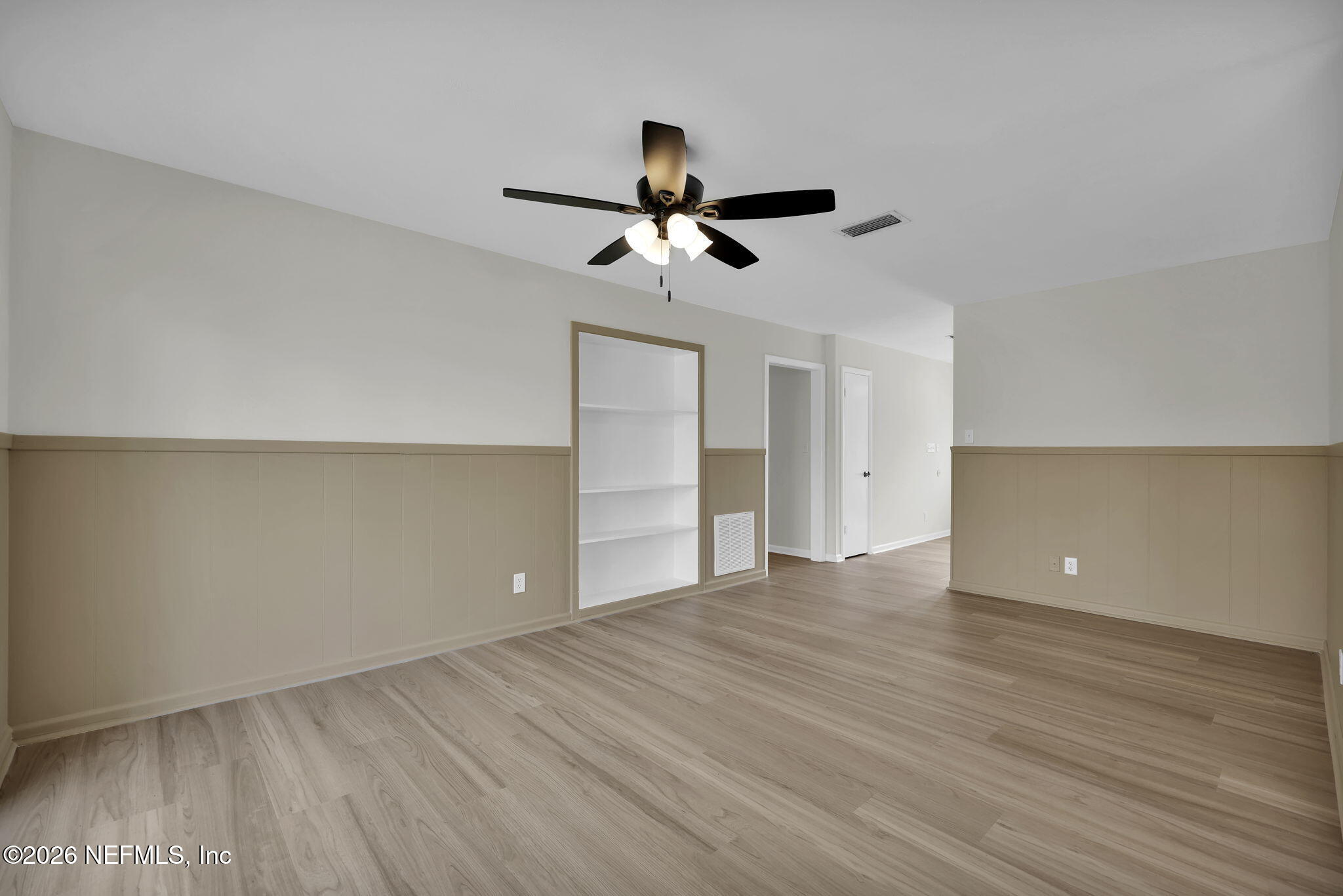 8544 Sanchez Road Jacksonville, FL 32217 - Photo 19 of 46 a view of an empty room with a ceiling fan