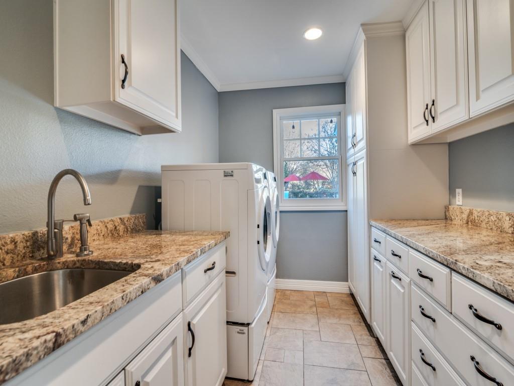 343 East Tripp Road Sunnyvale, TX 75182 - Photo 31 of 36 a kitchen with stainless steel appliances granite countertop a sink stove and refrigerator