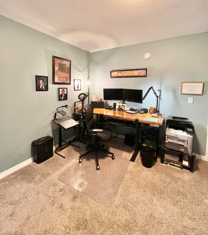 a room with furniture and a air conditioner vent
