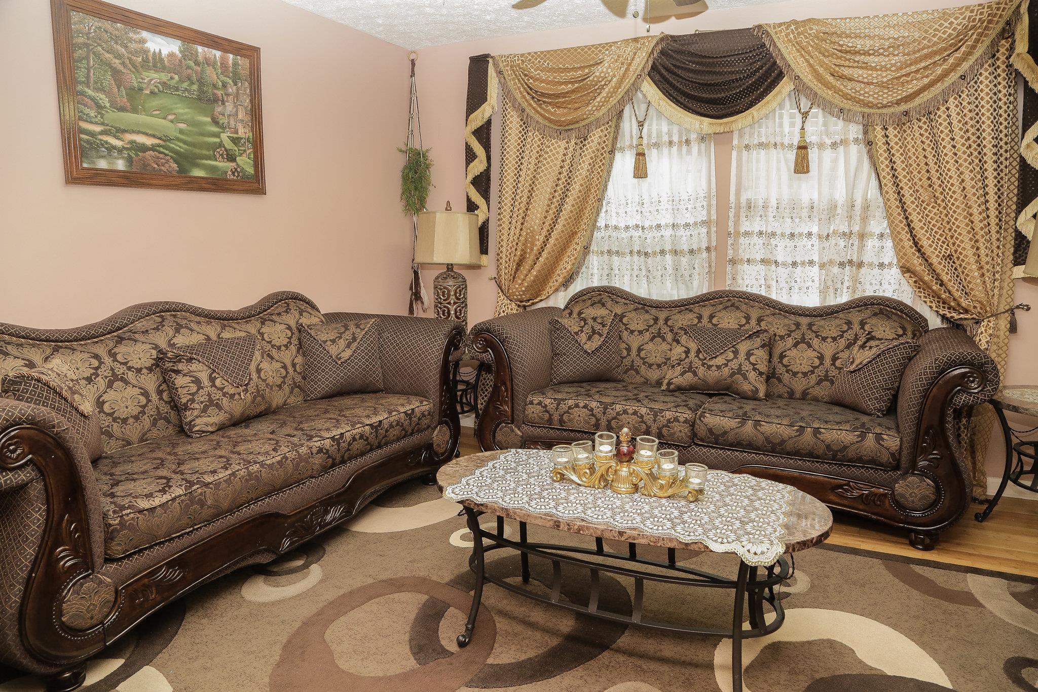 5301 Ridgefalls Way Antioch, TN 37013 - Photo 14 of 30 a living room with furniture and a chandelier