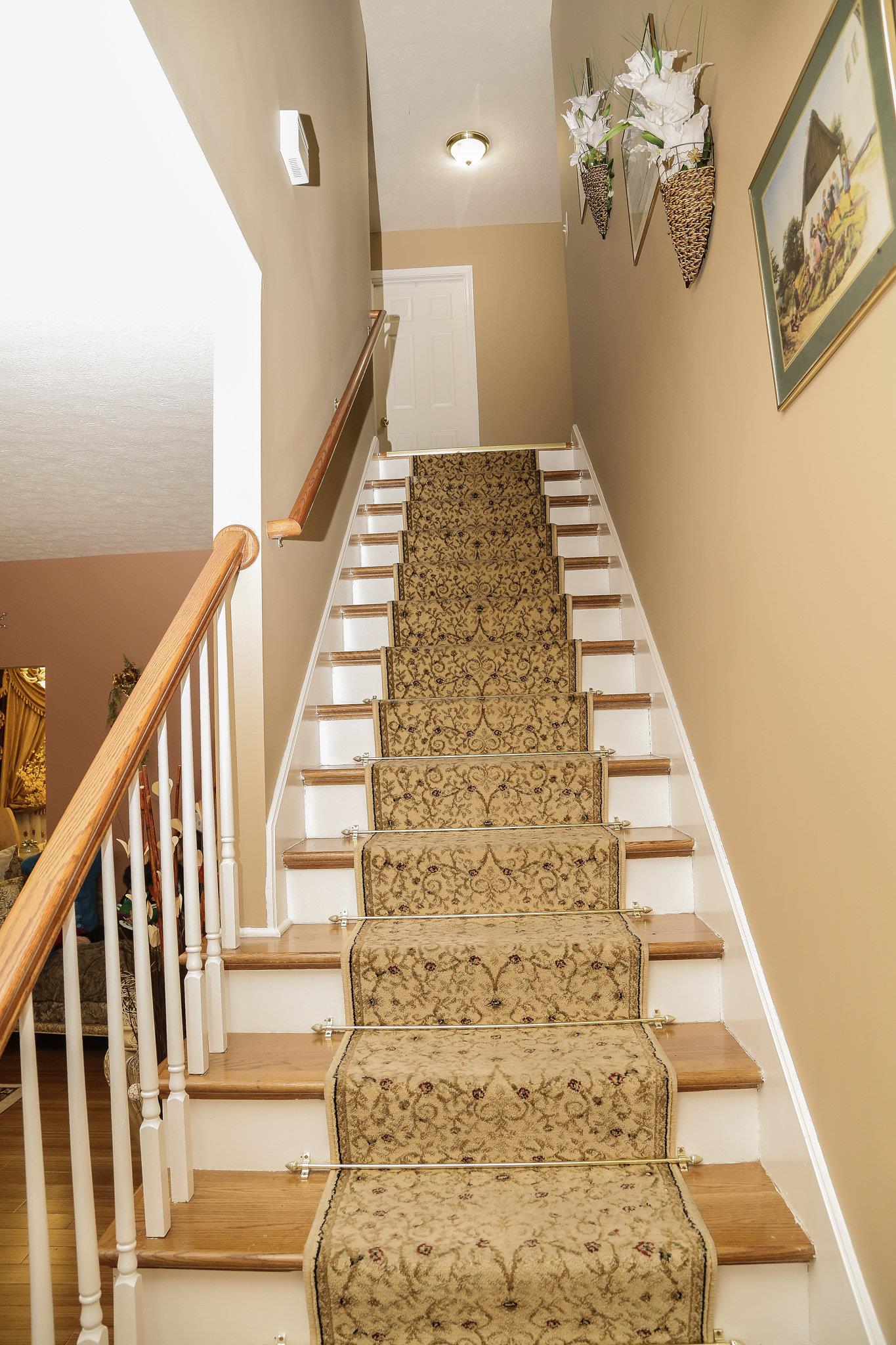 5301 Ridgefalls Way Antioch, TN 37013 - Photo 15 of 30 a view of staircase with wooden floor