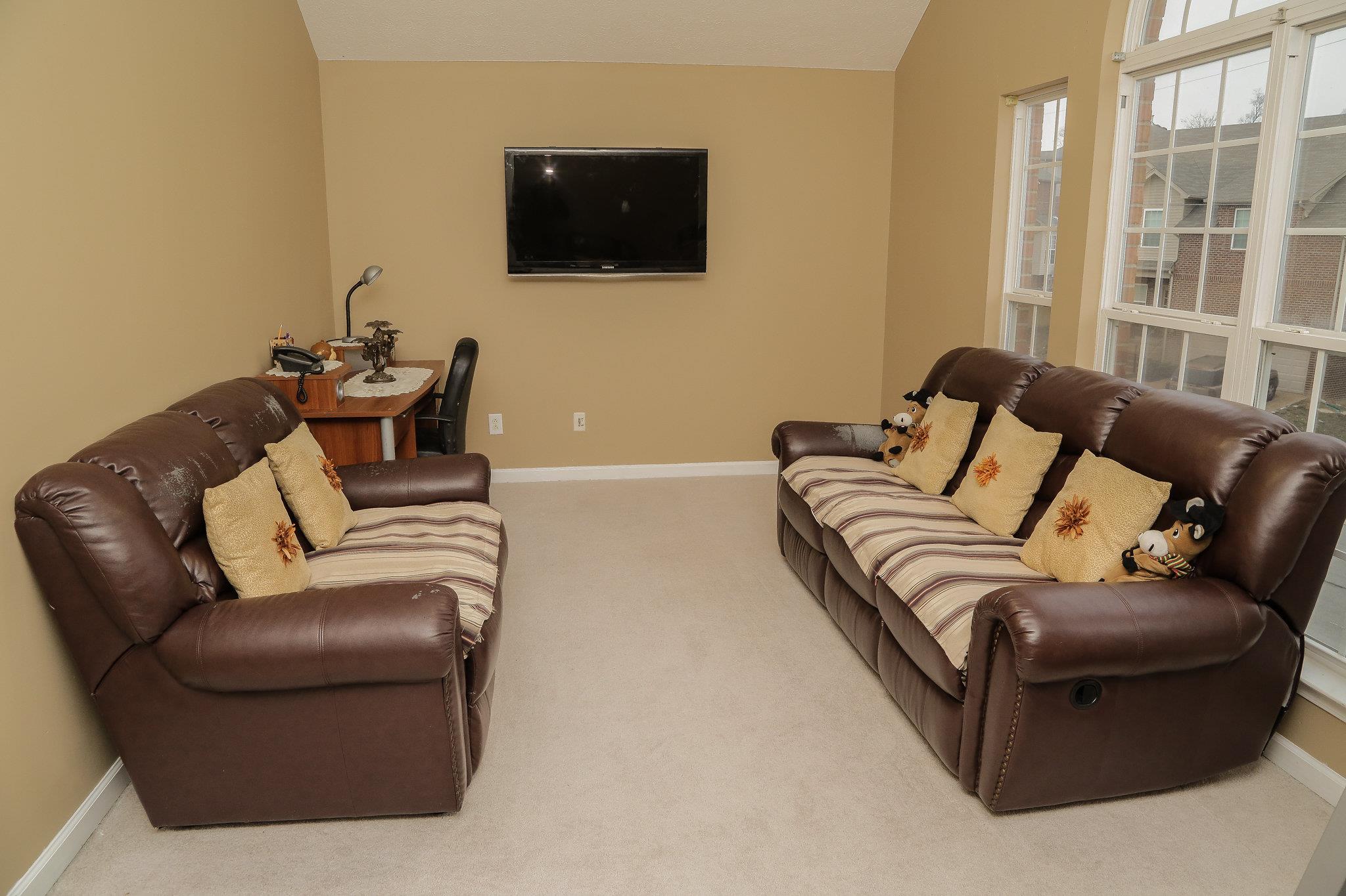 5301 Ridgefalls Way Antioch, TN 37013 - Photo 17 of 30 a living room with furniture and a flat screen tv