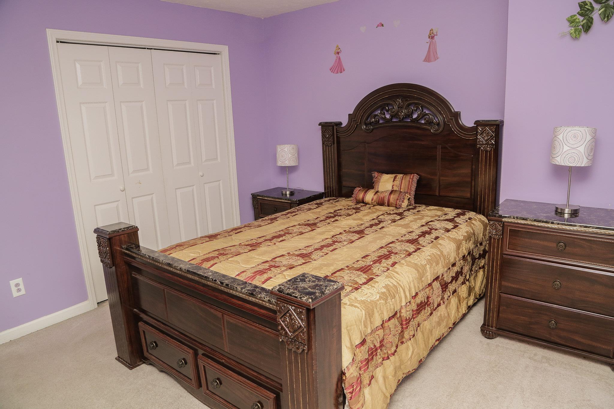 5301 Ridgefalls Way Antioch, TN 37013 - Photo 20 of 30 a bedroom with a bed and a dresser