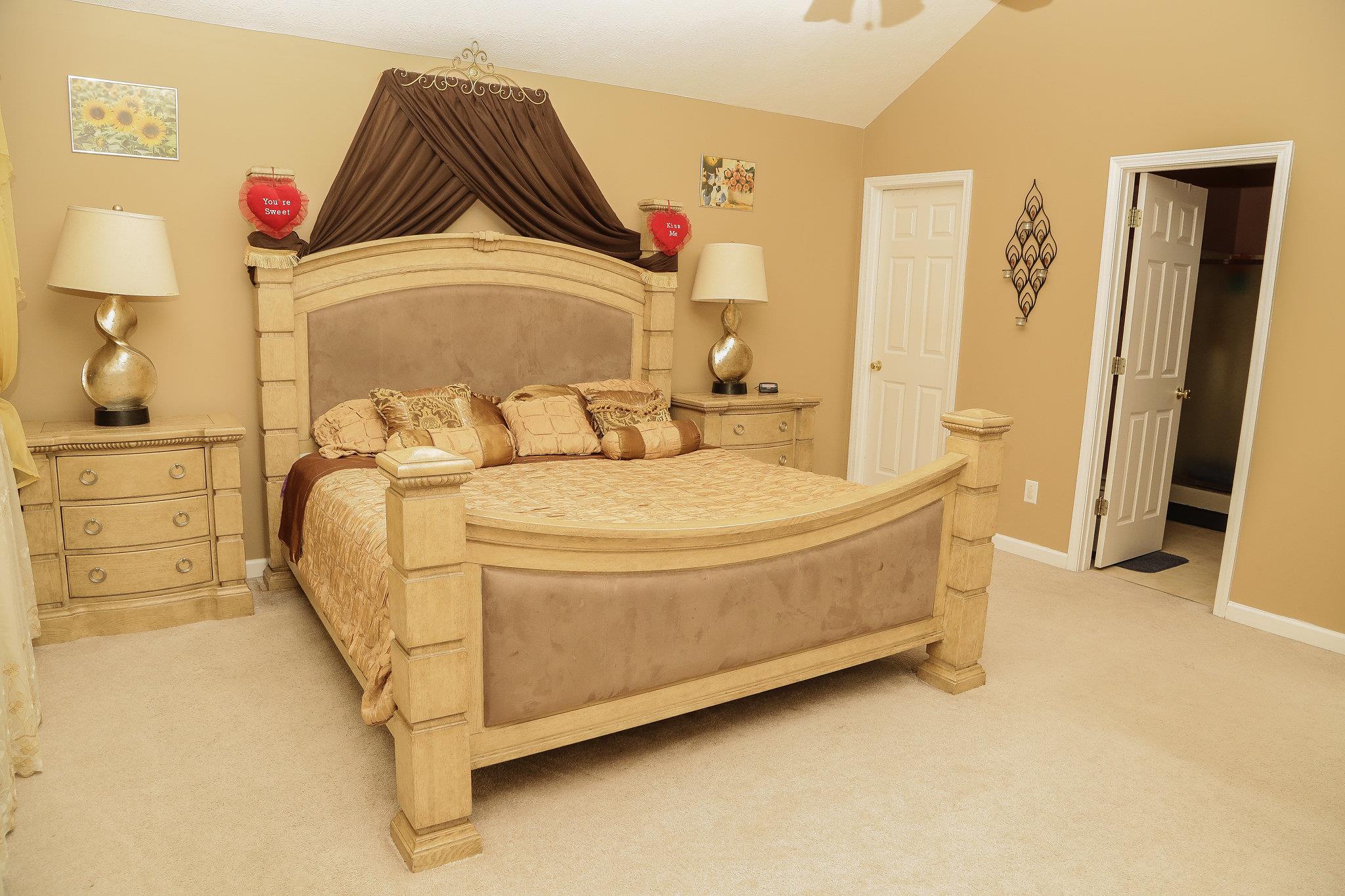 5301 Ridgefalls Way Antioch, TN 37013 - Photo 25 of 30 a bedroom with a bed and a walk in closet