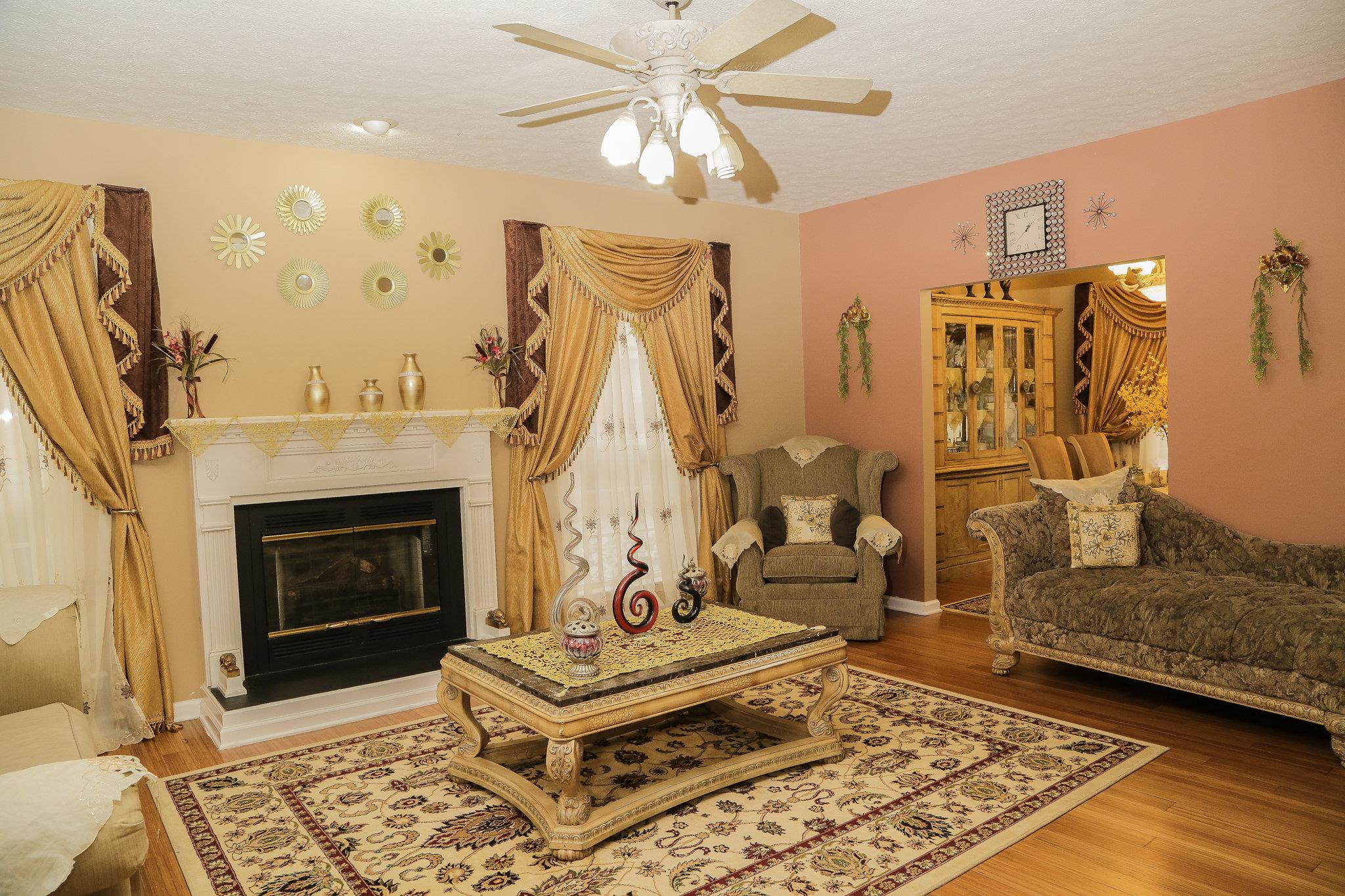 5301 Ridgefalls Way Antioch, TN 37013 - Photo 3 of 30 a living room with furniture and a fireplace