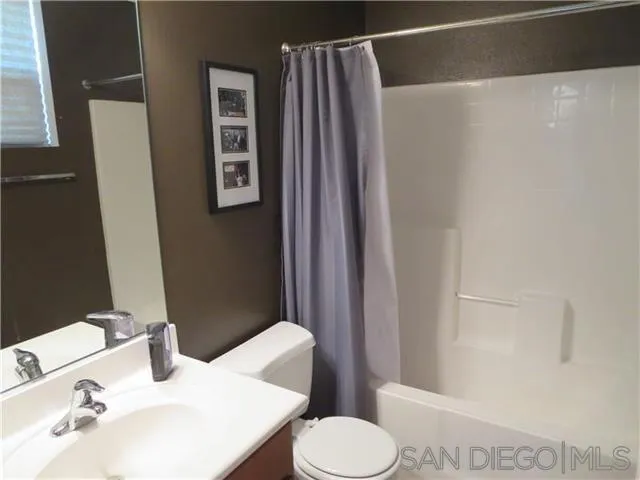 5074 Cascade Way, Unit 101 Oceanside, CA 92057 - Photo 11 of 12 a bathroom with a sink and toilet