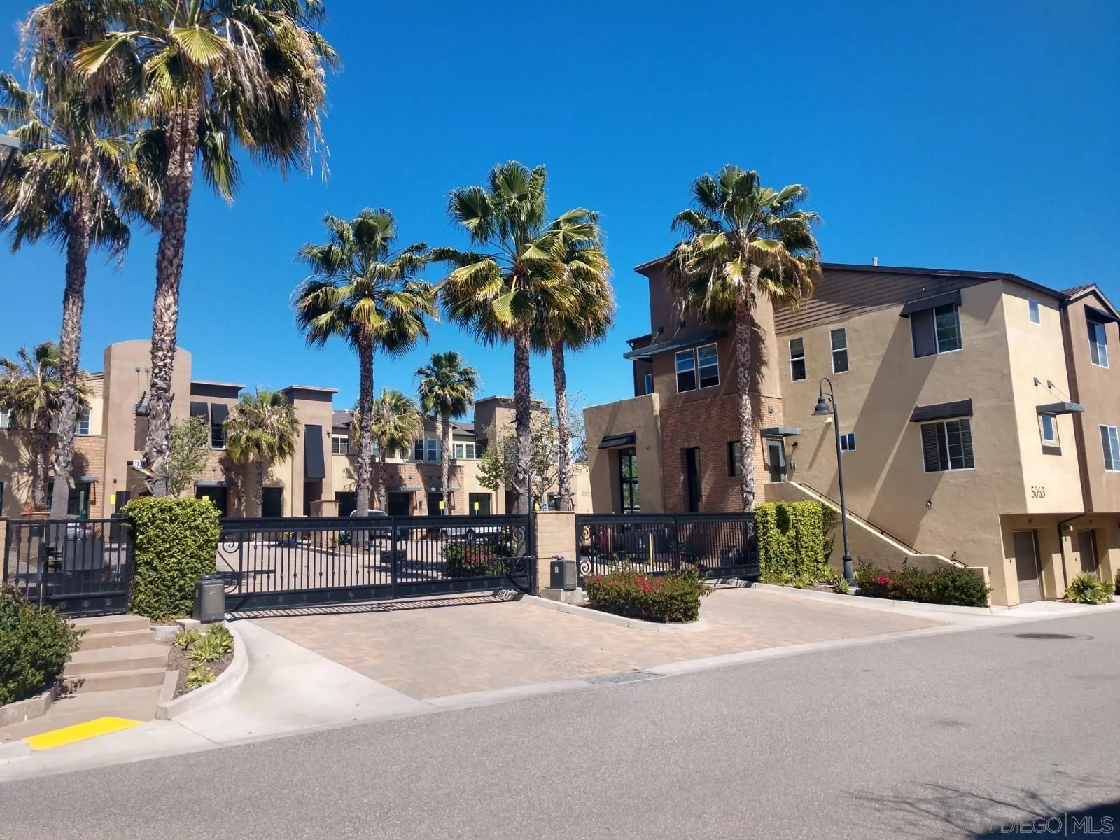 5074 Cascade Way, Unit 101 Oceanside, CA 92057 - Photo 2 of 12 a view of a street with a building in the background