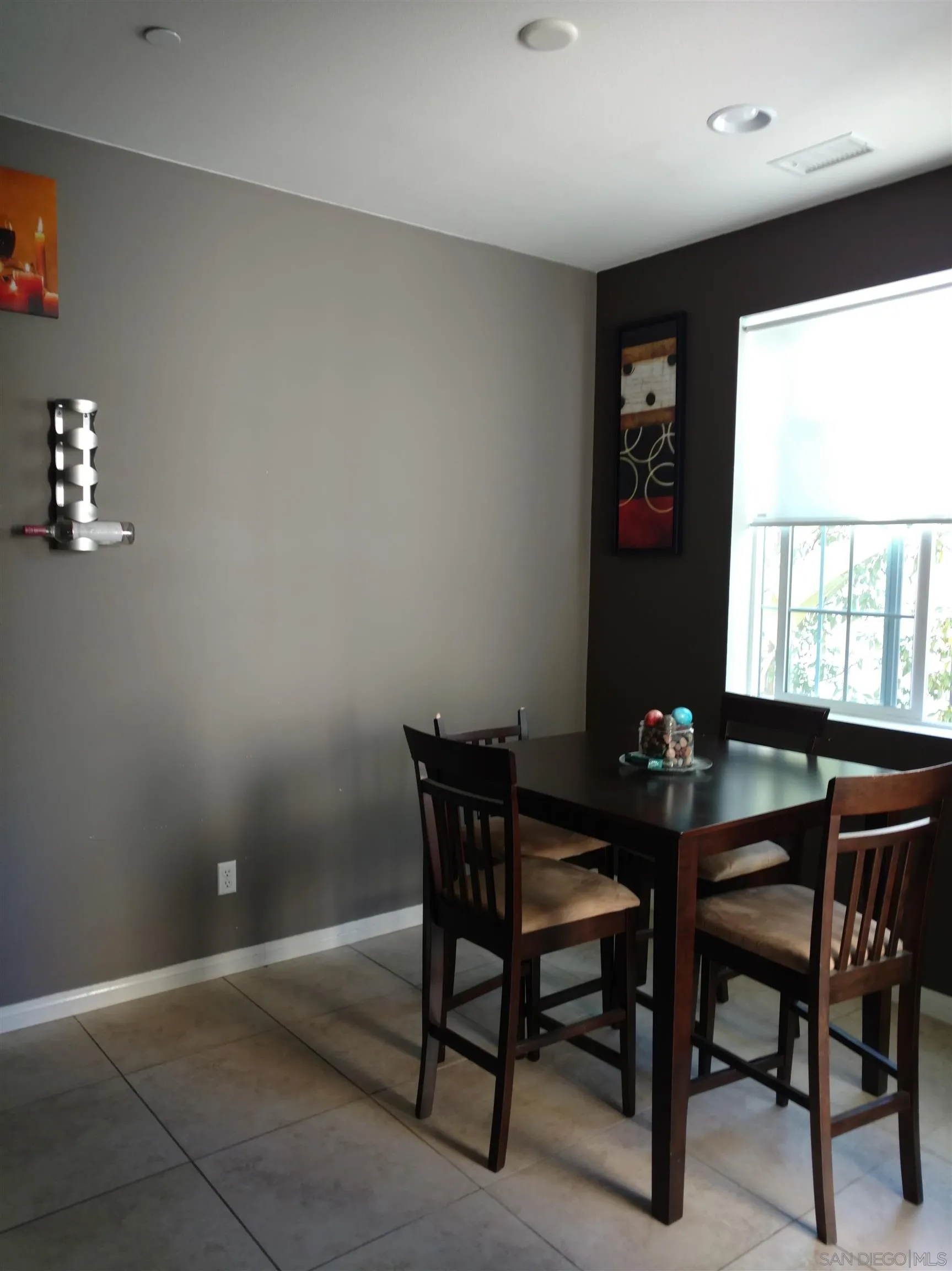 5074 Cascade Way, Unit 101 Oceanside, CA 92057 - Photo 8 of 12 a view of a dining room with furniture and window