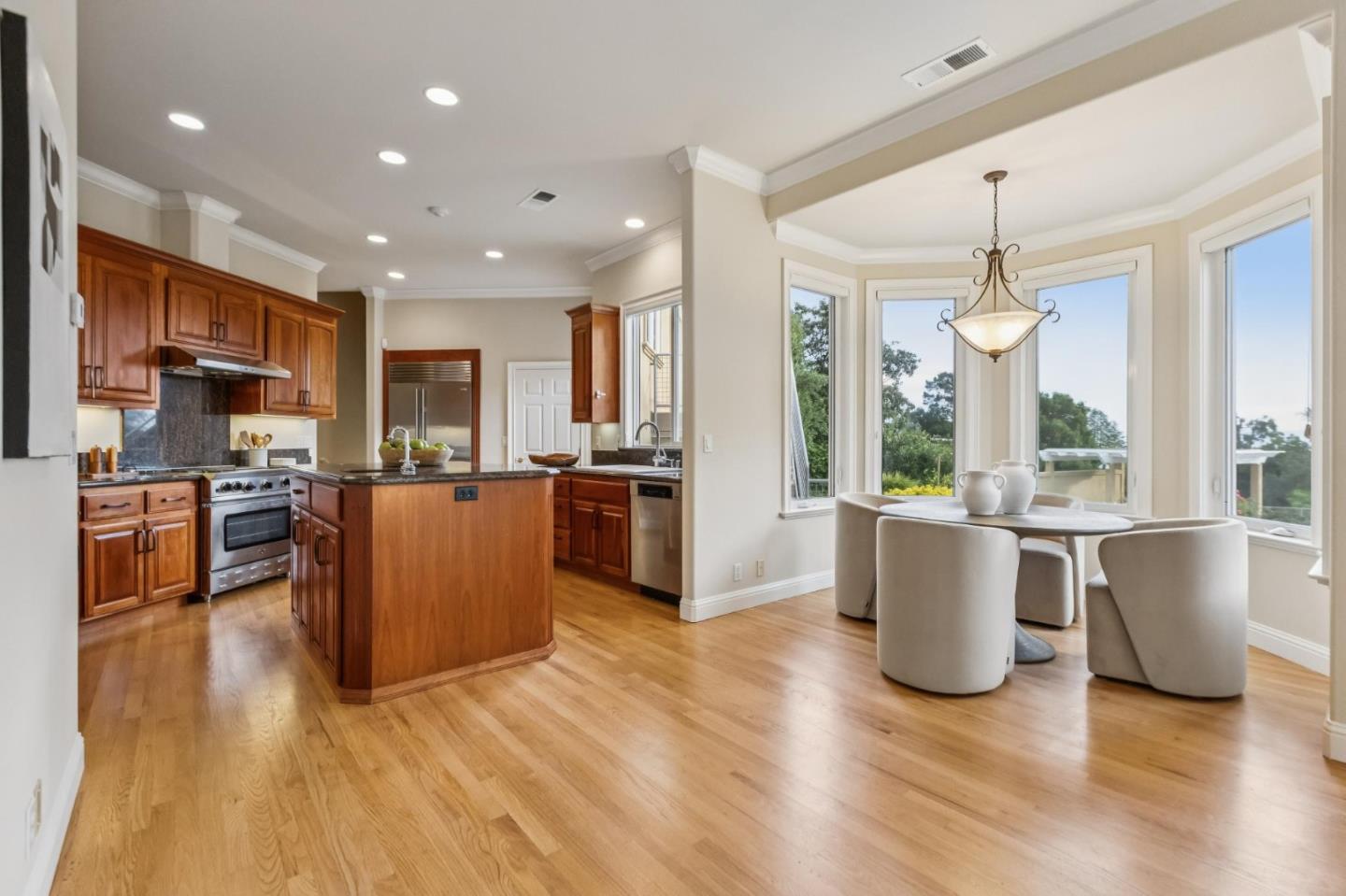 140 Ridgeway Road Woodside, CA 94062 - Photo 21 of 69 a large kitchen with cabinets and stainless steel appliances