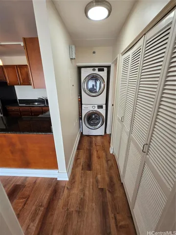 a bathroom with a sink a toilet a mirror and shower