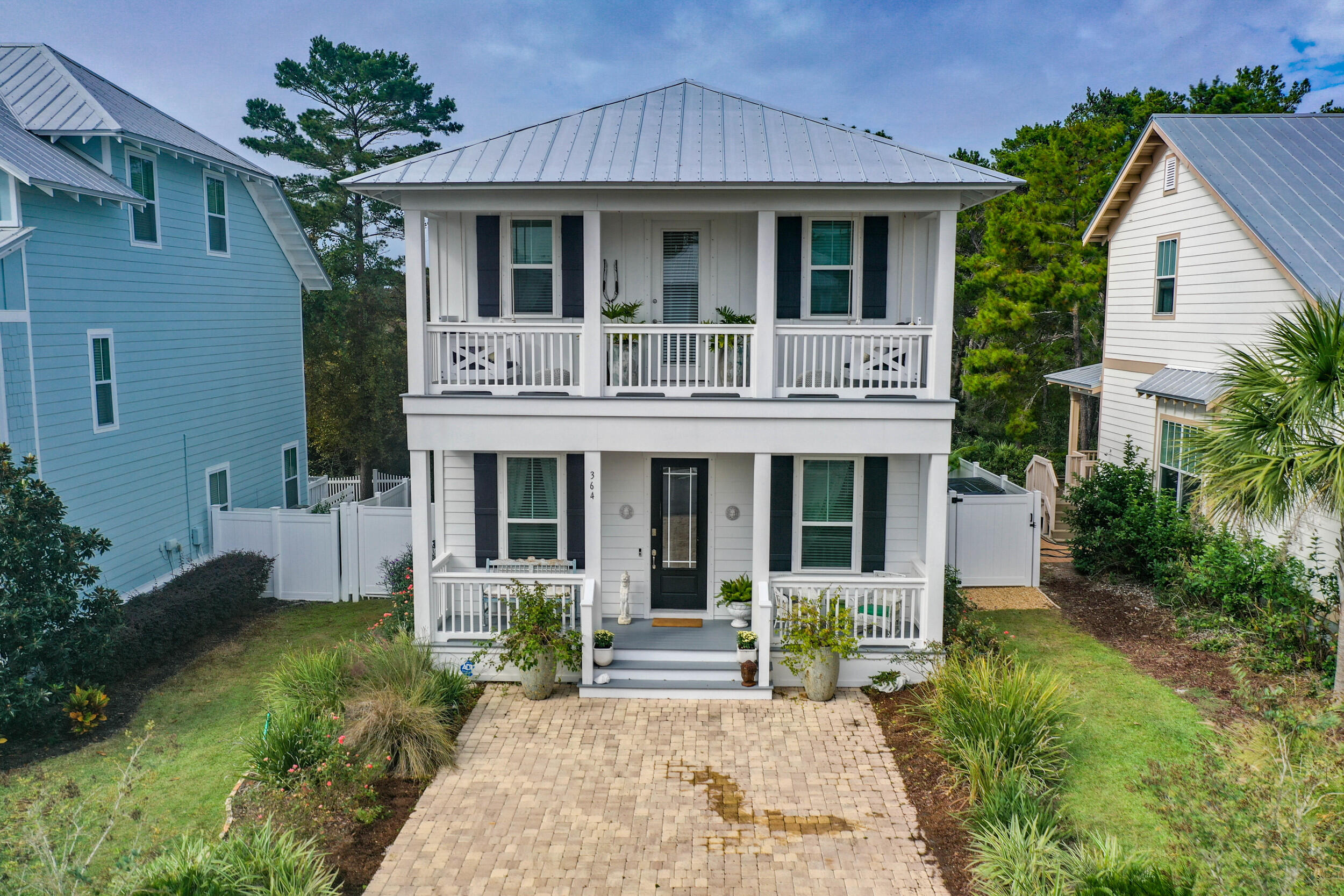 364 Grande Pointe Circle Inlet Beach, FL 32461 - Photo 1 of 26 a front view of a house with garden