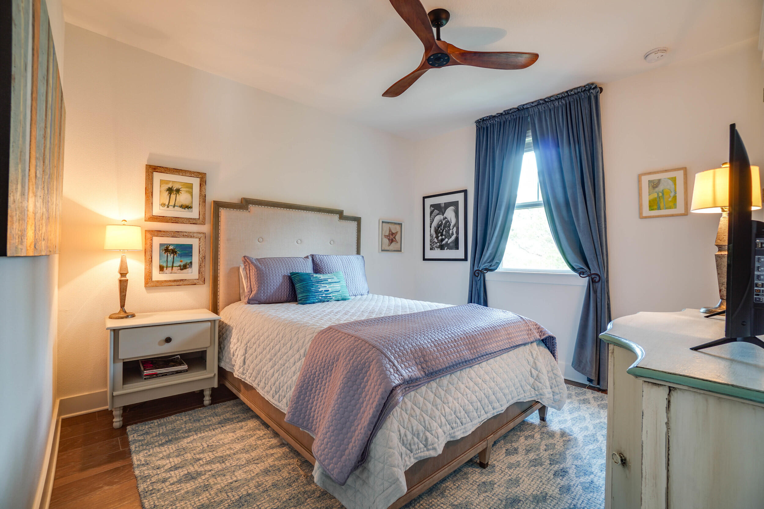 364 Grande Pointe Circle Inlet Beach, FL 32461 - Photo 13 of 26 a bedroom with a bed a mirror on the dresser and a window