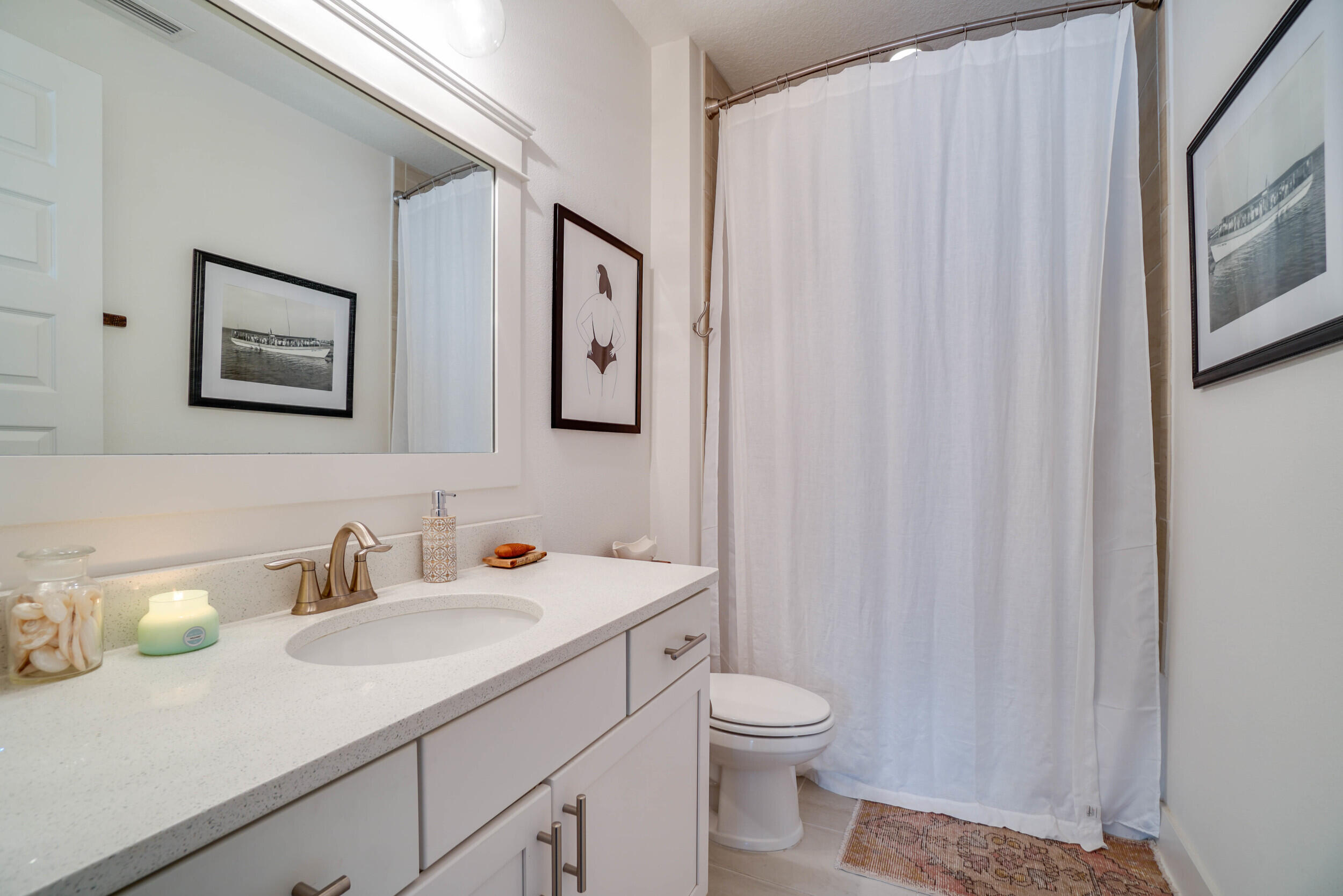 364 Grande Pointe Circle Inlet Beach, FL 32461 - Photo 15 of 26 a bathroom with a sink mirror and toilet