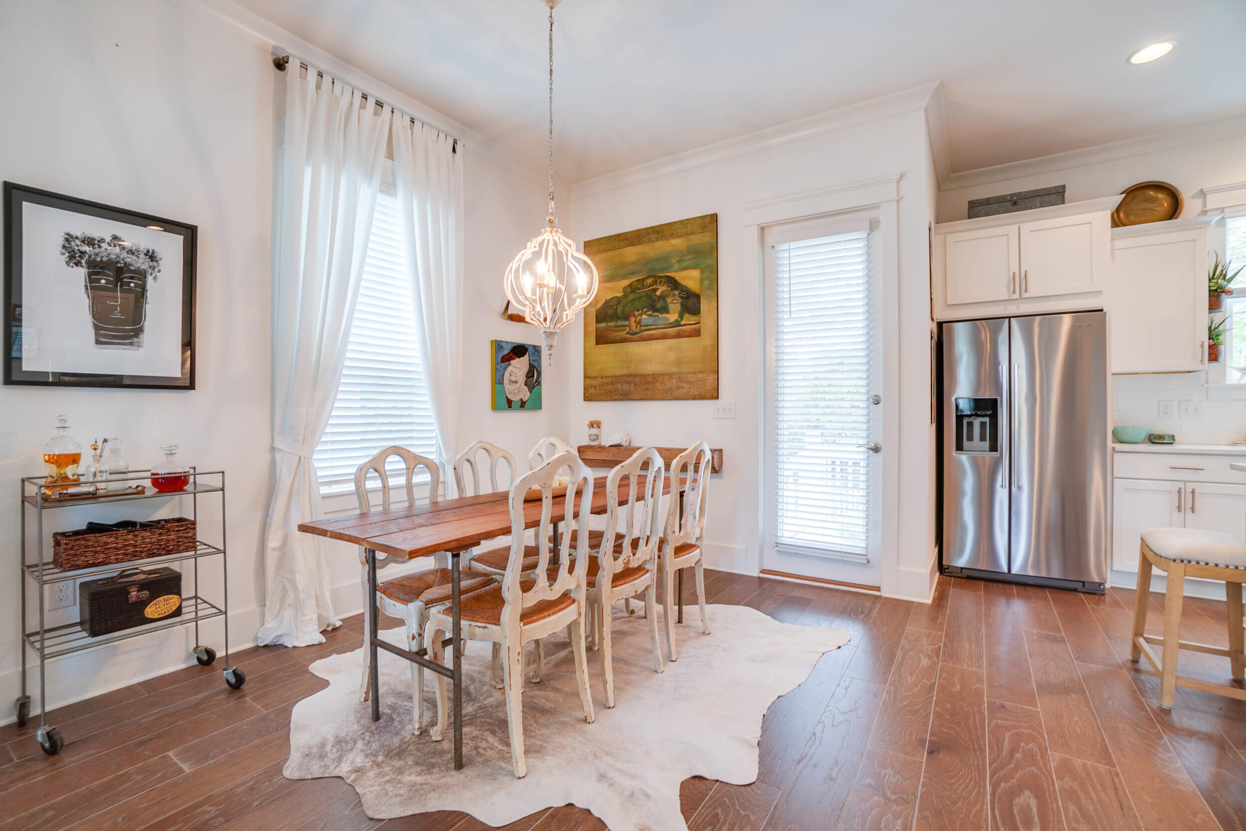 364 Grande Pointe Circle Inlet Beach, FL 32461 - Photo 6 of 26 a view of a dining room with furniture window and wooden floor
