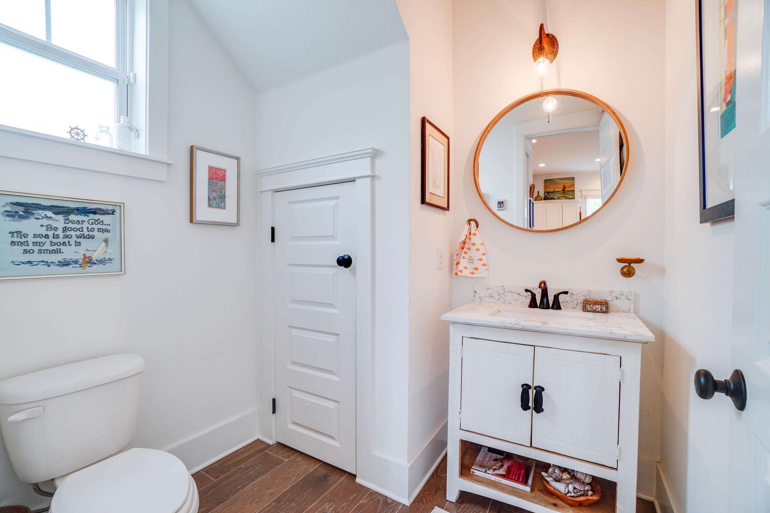 364 Grande Pointe Circle Inlet Beach, FL 32461 - Photo 10 of 26 a bathroom with a toilet a sink and a mirror
