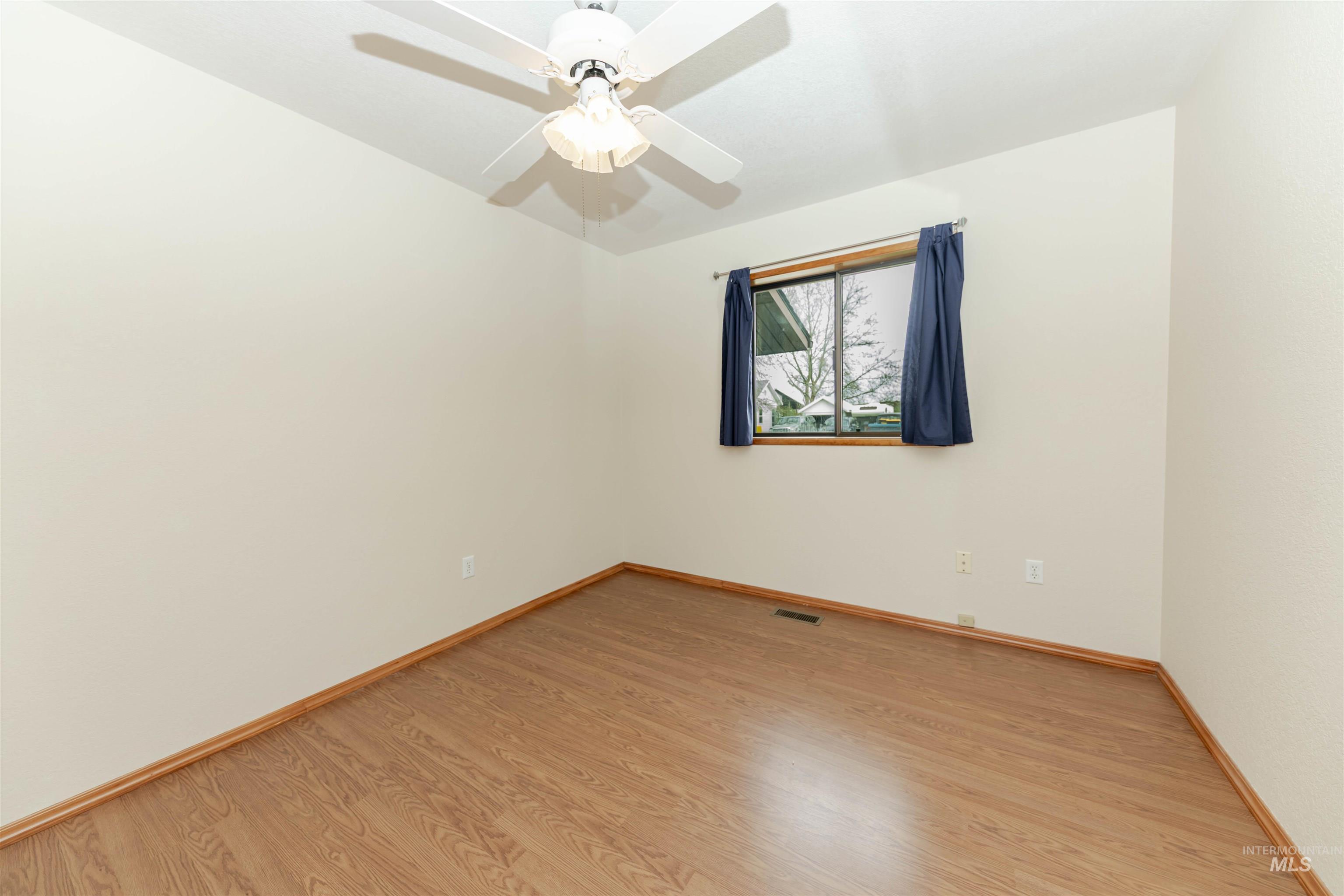 1316 29th Street Lewiston, ID 83501 - Photo 14 of 31 Bedroom with light wood-type flooring and ceiling fan