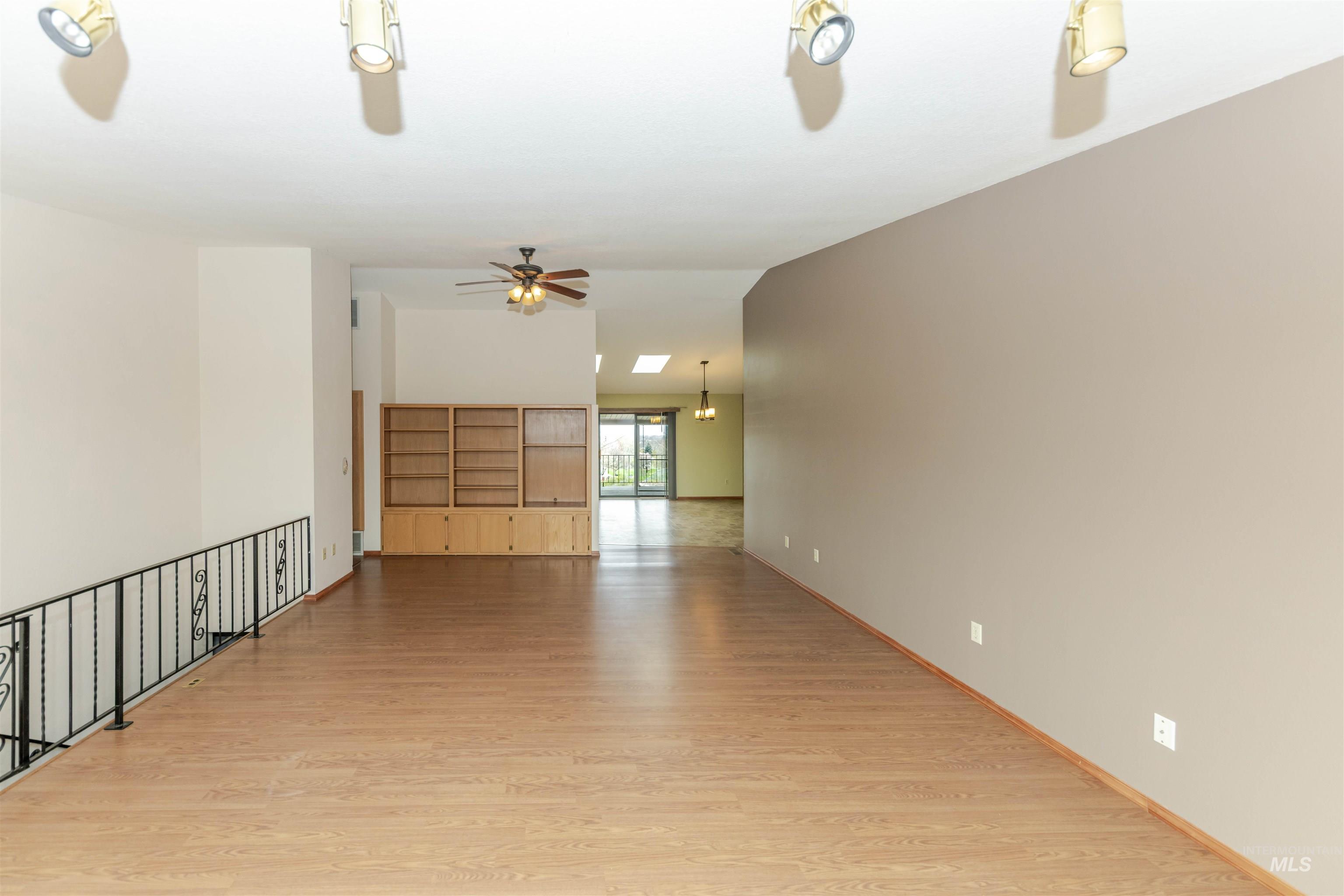 1316 29th Street Lewiston, ID 83501 - Photo 2 of 31 Livingroom with light wood-type flooring, a ceiling fan, and vaulted ceiling