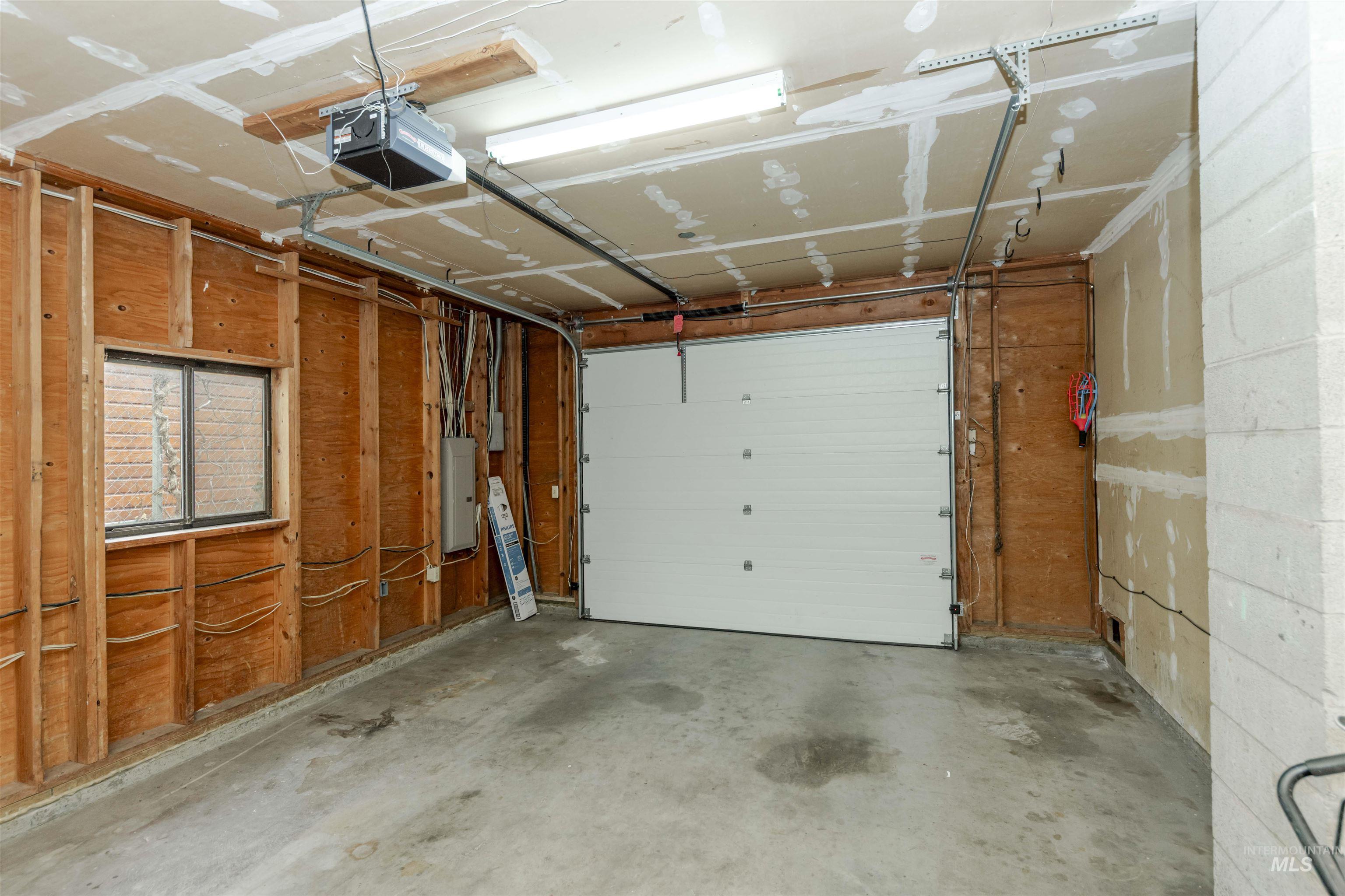1316 29th Street Lewiston, ID 83501 - Photo 30 of 31 Garage with a garage door opener and electric panel