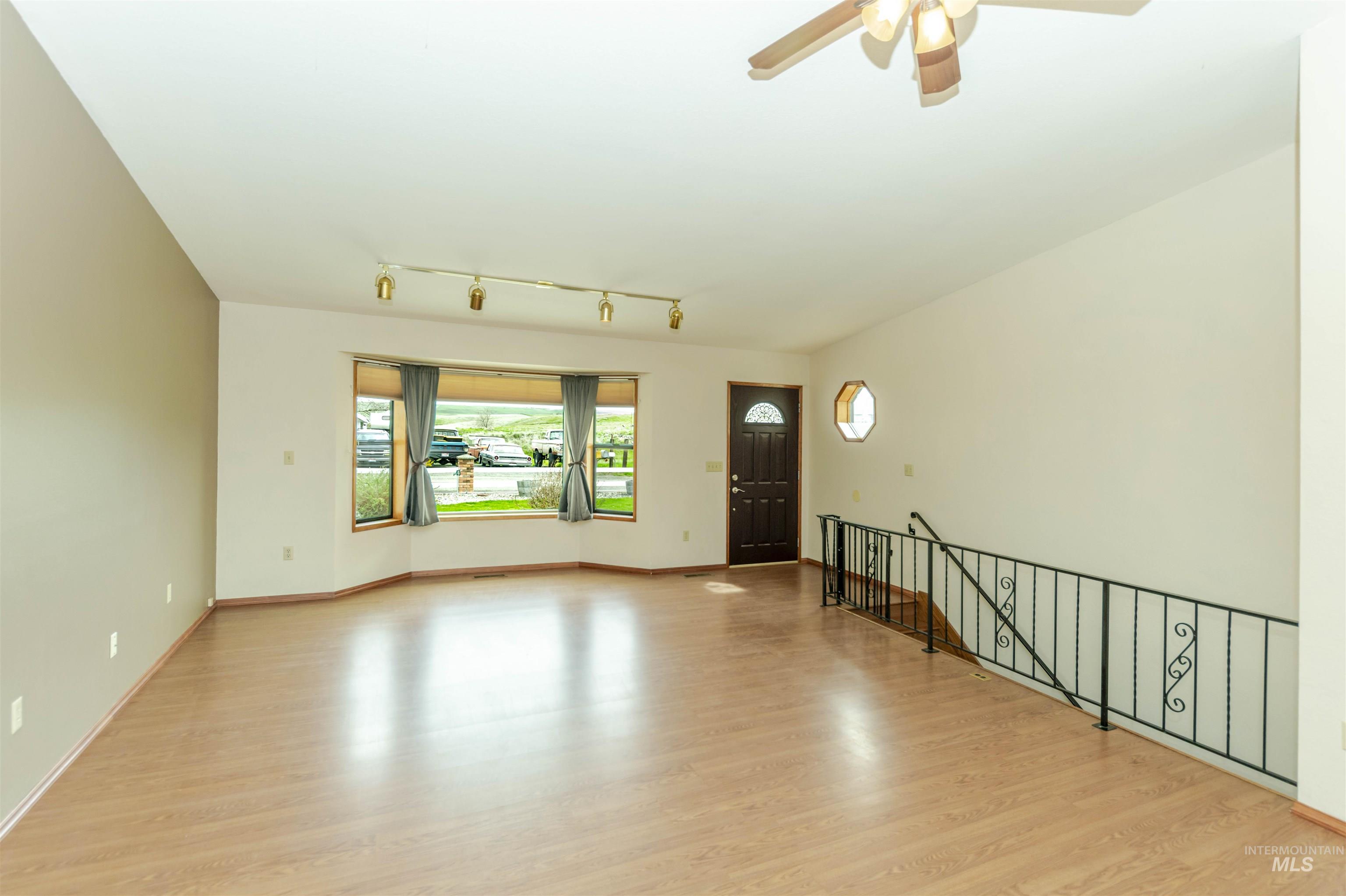 1316 29th Street Lewiston, ID 83501 - Photo 3 of 31 Living room featuring light wood-style flooring and a ceiling fan