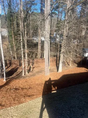 a view of balcony with wooden floor
