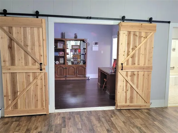 a view of entryway with wooden floor