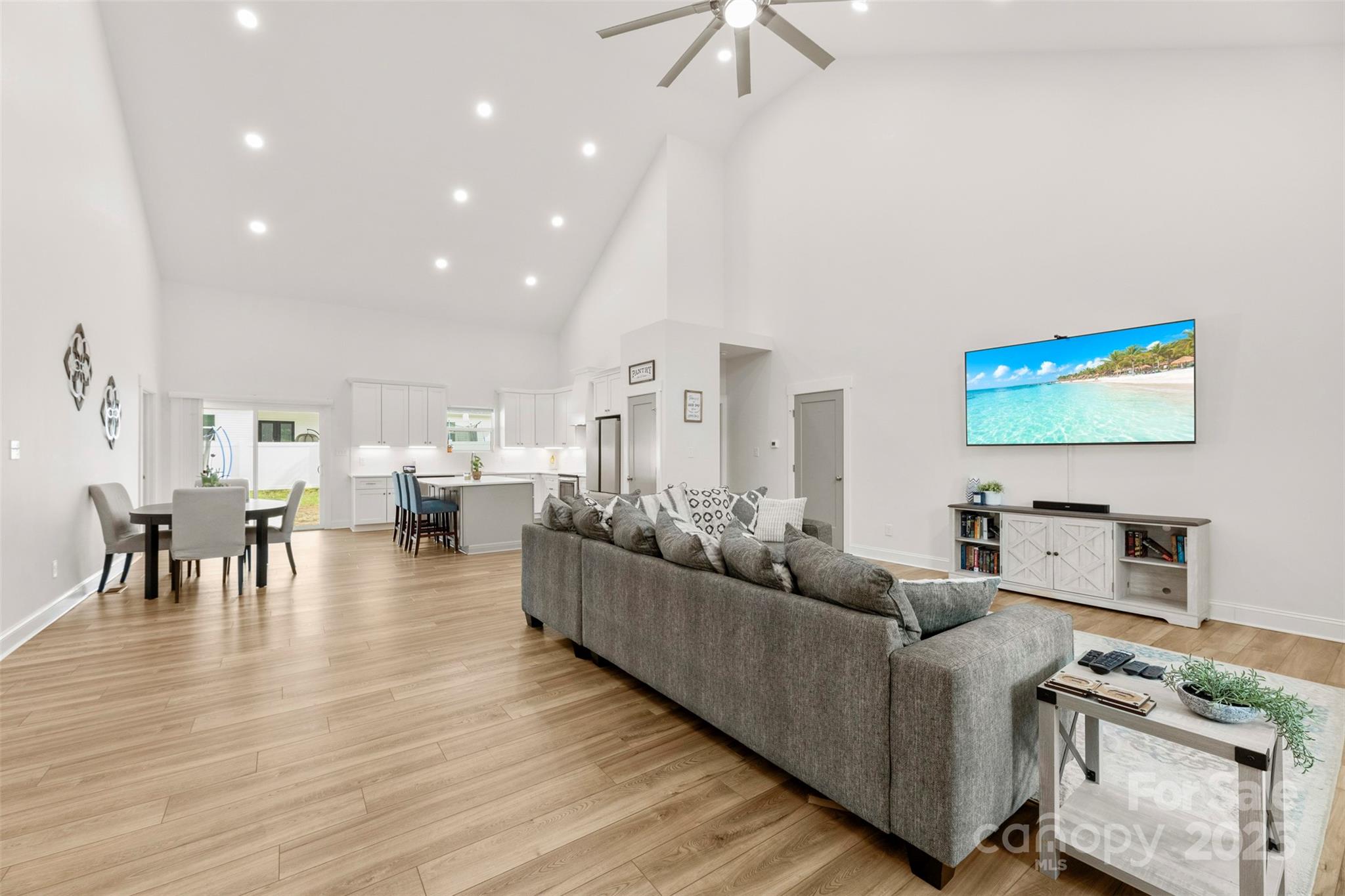 7683 Sarah Drive Denver, NC 28037 - Photo 2 of 25 a living room with furniture and a flat screen tv