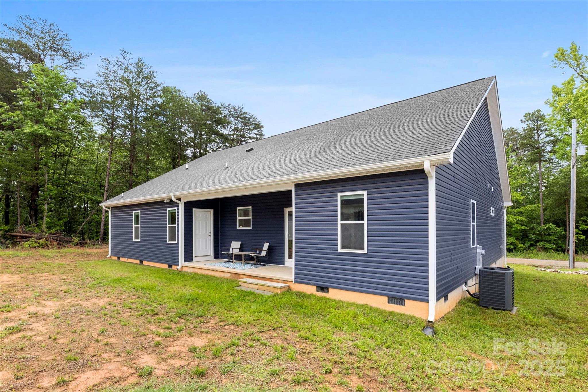 7683 Sarah Drive Denver, NC 28037 - Photo 24 of 25 a view of a house with a yard and plants